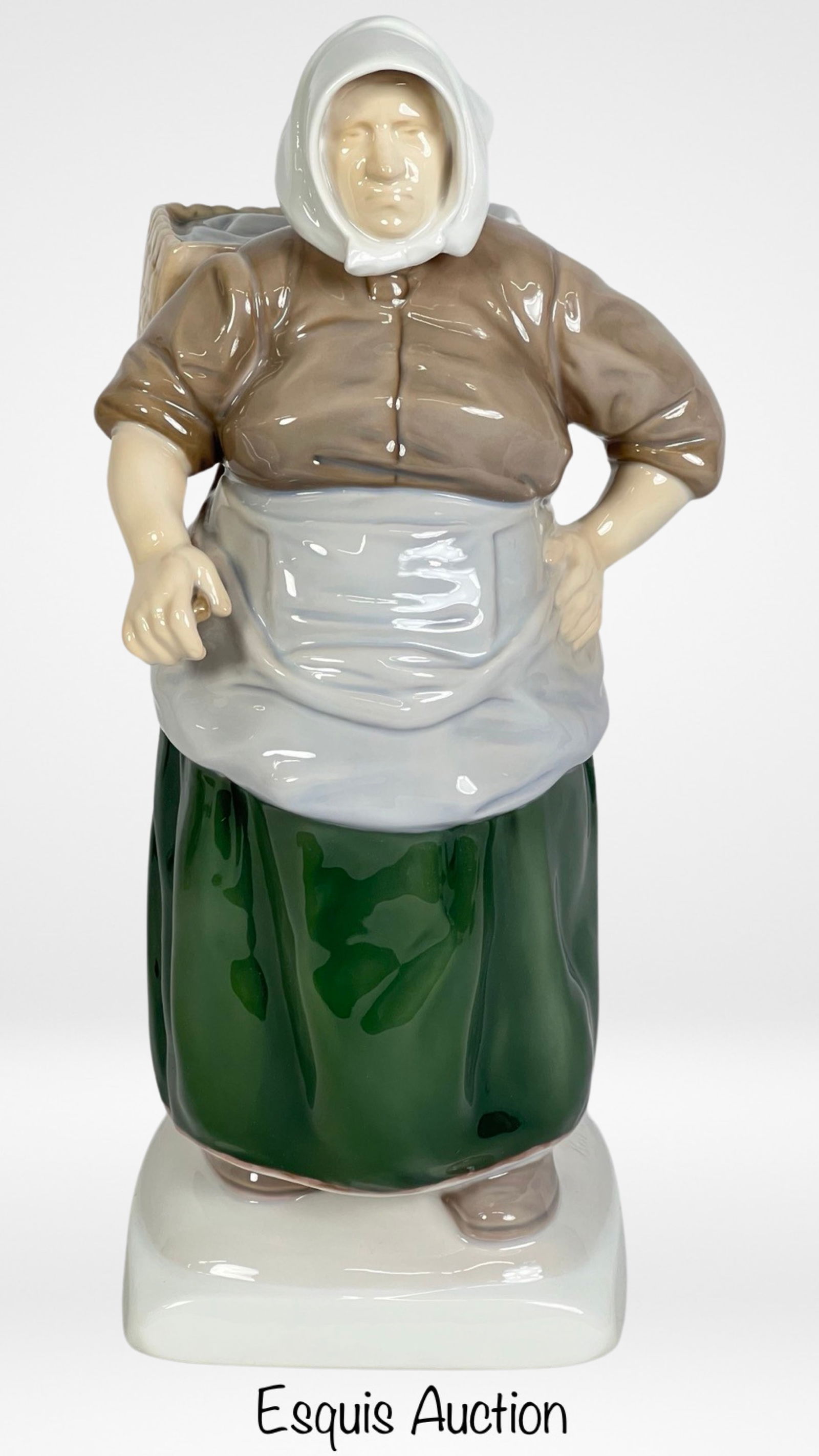 Bing & Grondahl B&G 'Danish Fisherwoman' Figurine: Adorn your collection with the timeless elegance of the Bing & Grondahl "Danish Fisherwoman" Porcelain Figurine, by sculptor Kai Nielsen. 1702. Standing at 11 inches tall, this exquisite piece capture