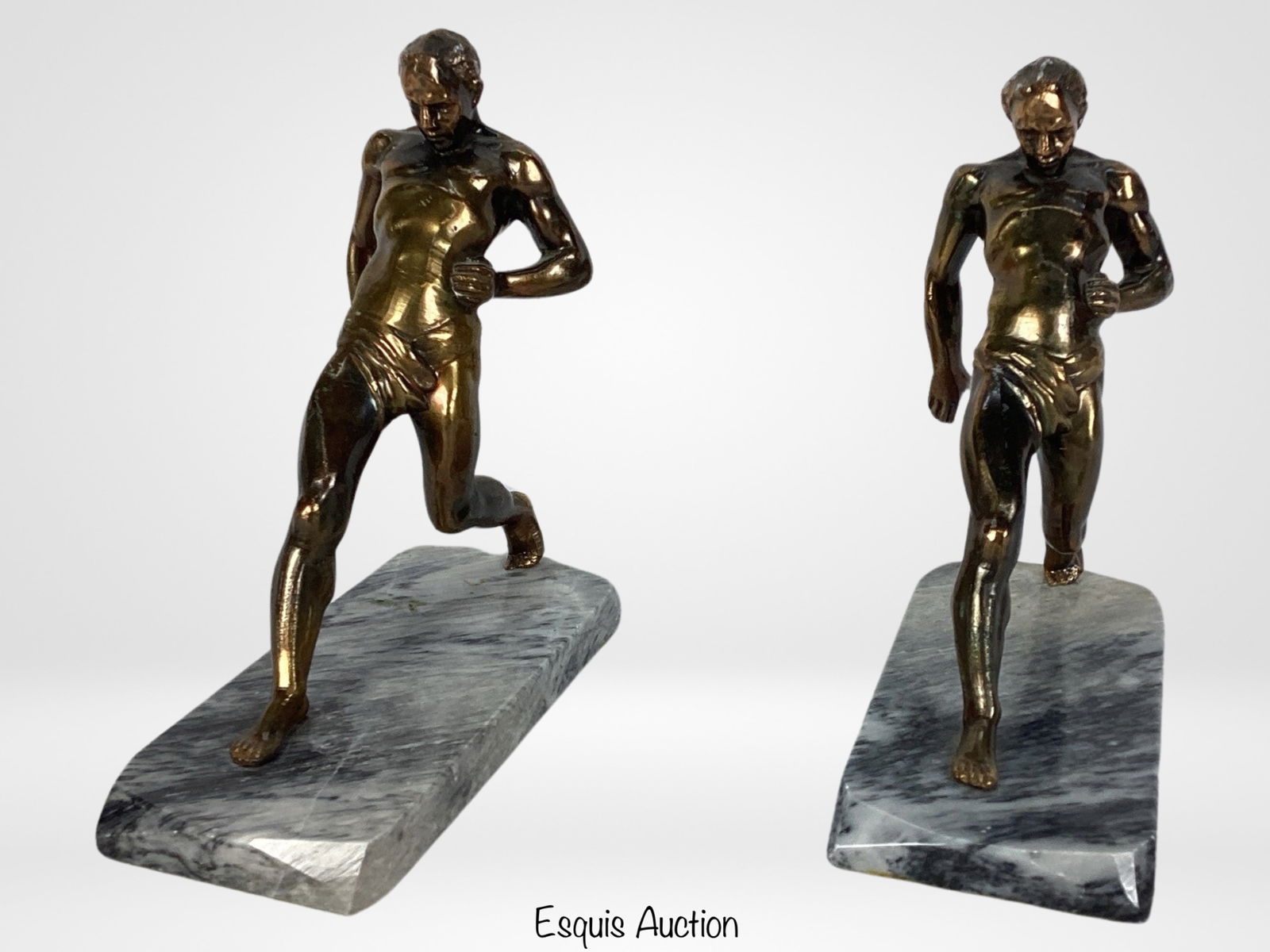 Vintage Athlete Runners Bookends- Bronze Finish Me: Add a touch of vintage athleticism to your bookshelf with this charming pair of Athlete Runners Bookends. Crafted from bronze-finished spelted metal and featuring detailed depictions of runners in act