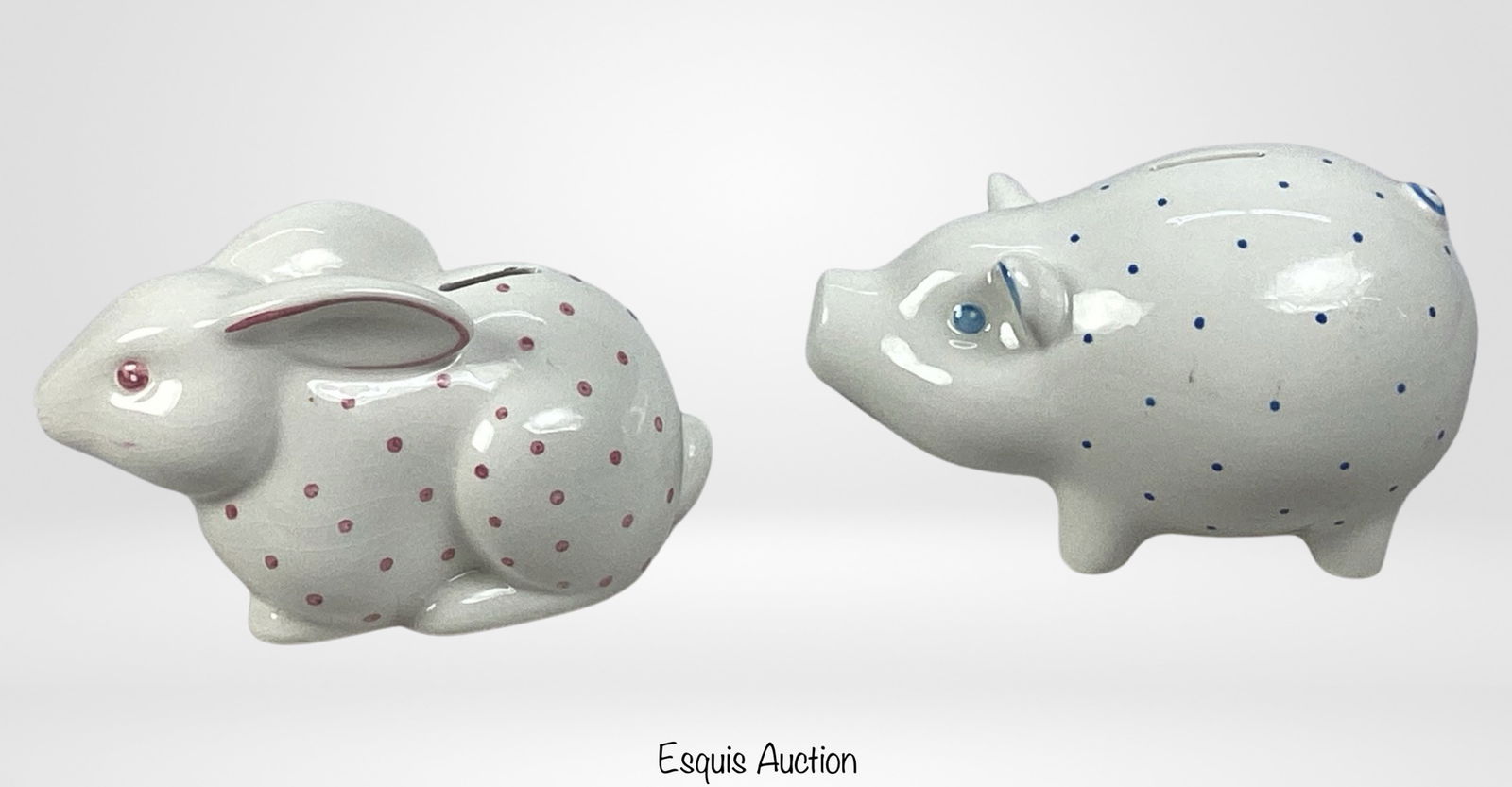 Tiffany & Co Porcelain Bunny & Piggy Coin Banks: Add a touch of whimsy to your collection with this charming set of Tiffany & Co Porcelain Bunny and Piggy Coin Banks. The Bunny bank measures 8" x 5.5", while the Piggy bank stands at 8" x 4.5".