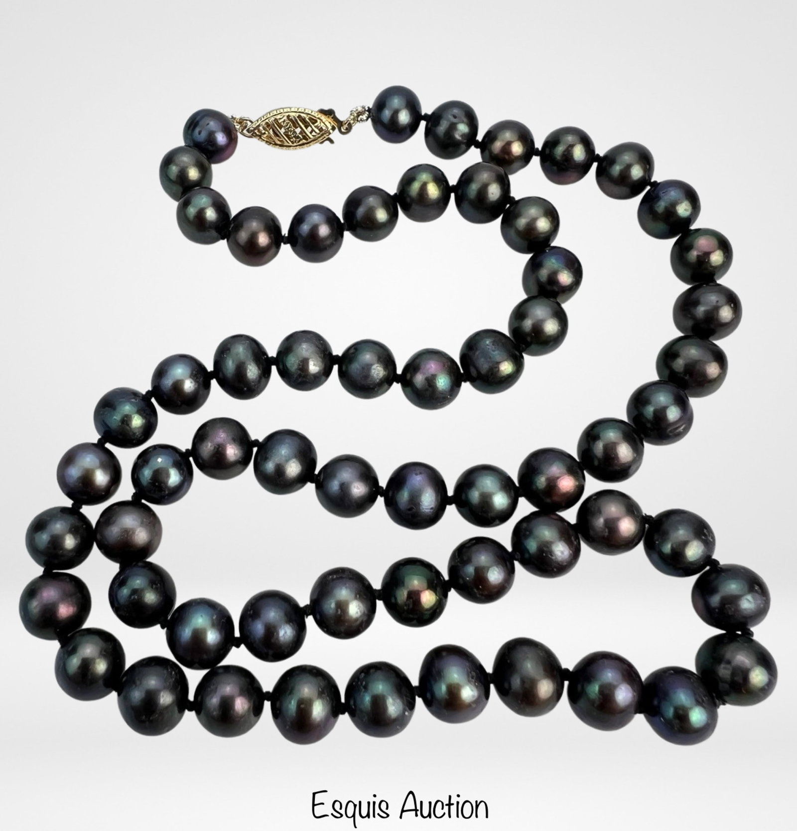 Tahitian Black Pearls Necklace with 14k Gold Clasp: Tahitian Black Pearls Necklace with 14k Gold Clasps. 16 1/2" long. Good Condition.