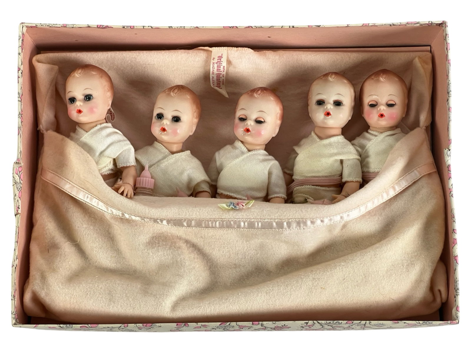 Madame Alexander Fisher Quintuplets Dolls: Madame Alexander Fisher Quintuplets Dolls in original box. The dolls commemorate the Fisher quintuplets who were born in 1963 in South Dakota and the first set of surviving quints in the US. Dolls are