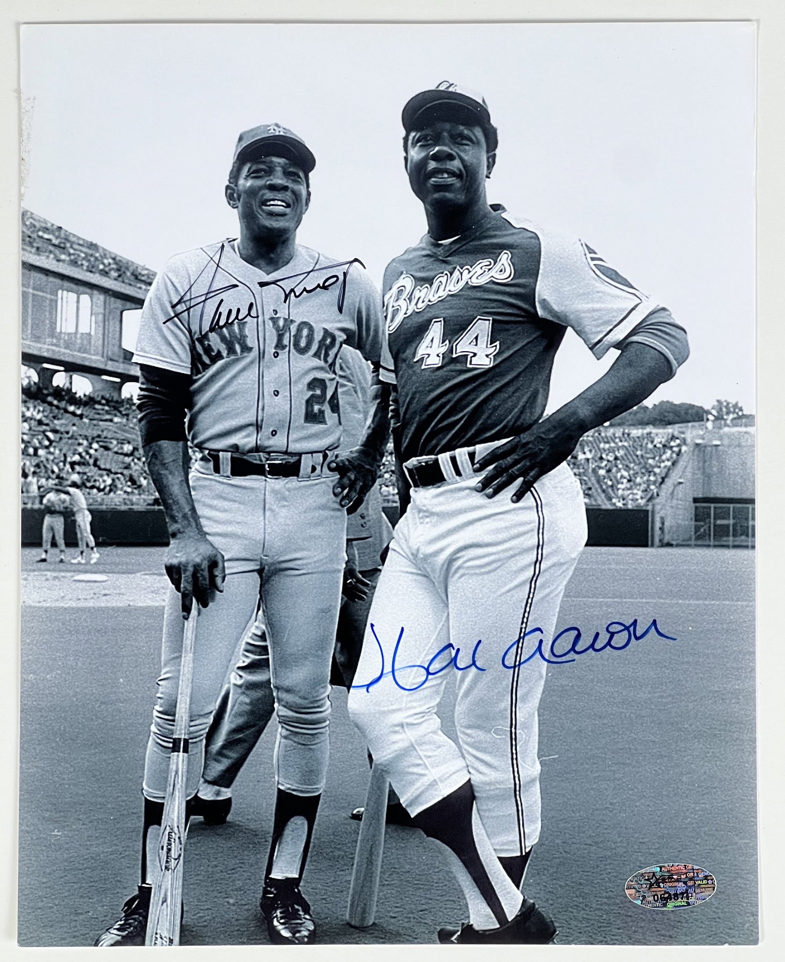 Hank Aaron & Willie Mays Signed Photograph: The Hank Aaron and Willie Mays Signed 8" x 10" Photograph is a remarkable piece that captures the essence of baseball history. With the signatures of two legendary players adorning this photograph, it