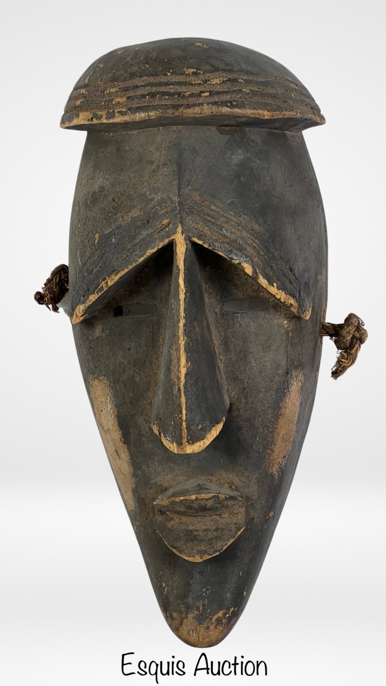African Wood Carved Lwalwa Dance Mask Ngongo Peapl: This mesmerizing wood carved dance mask originates from the Ngongo people of the Lwalwa culture, an ethnic group residing in Central Africa. Dating back to the earlier 20th century, this remarkable ma