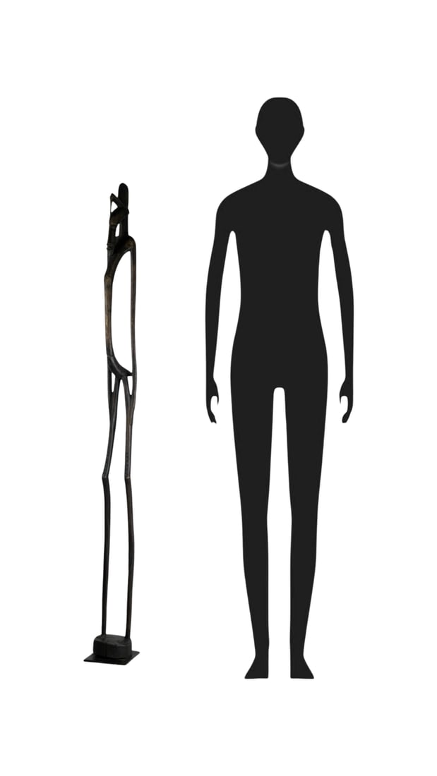 African Senufo Rhythm Pounder 62" Wooden Figure: This African Senufo Rhythm Pounder Figure, originating from the Ivory Coast, stands at an impressive height of 62 inches. Crafted from wood, it represents the artistic mastery and cultural significanc