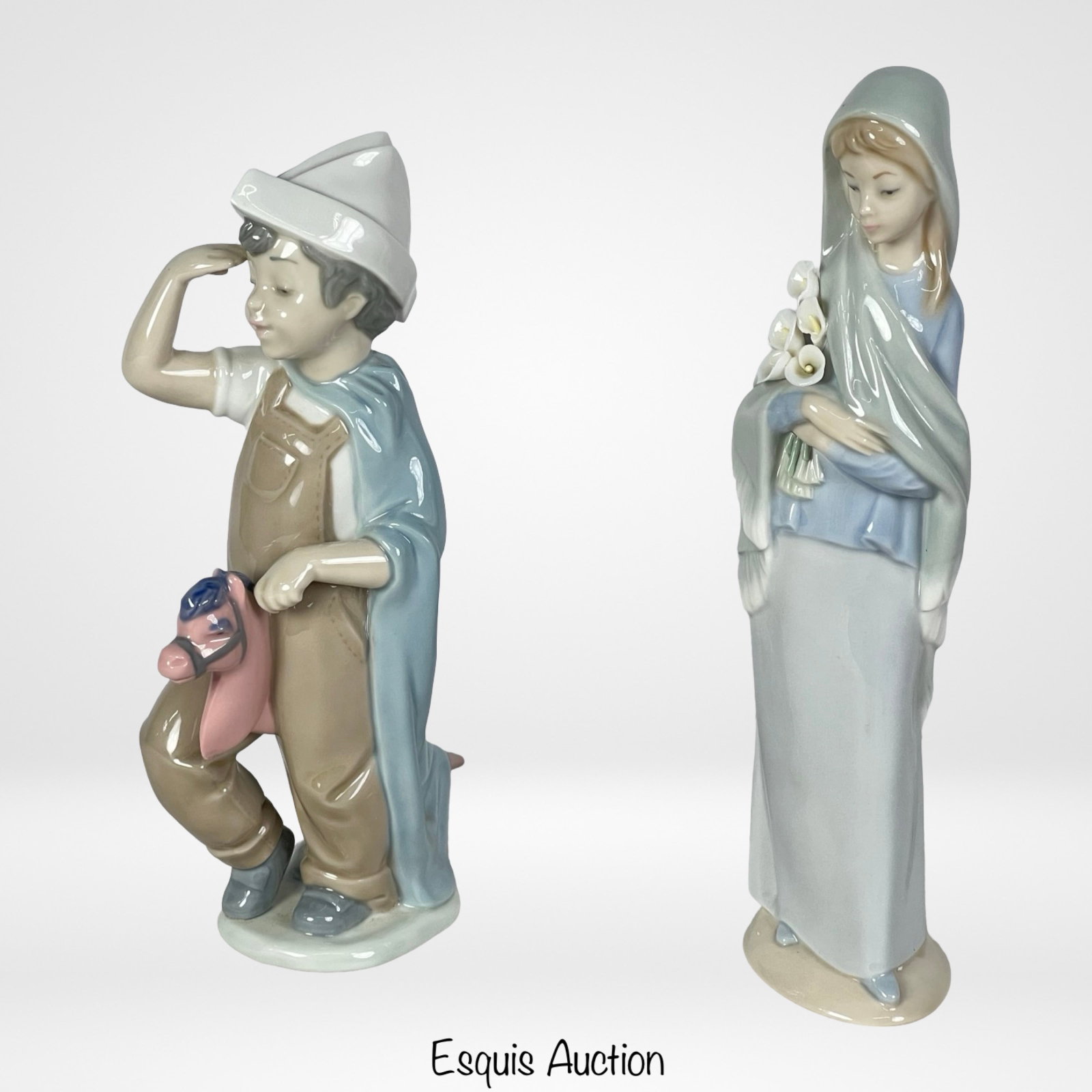 Two Lladro Porcelain Figurines: This captivating lot includes two exquisite porcelain figurines, showcasing the timeless elegance and artistry of Lladro. Nao by Lladro "Little Conquistador" Porcelain Figurine and Lladro "Girl with C