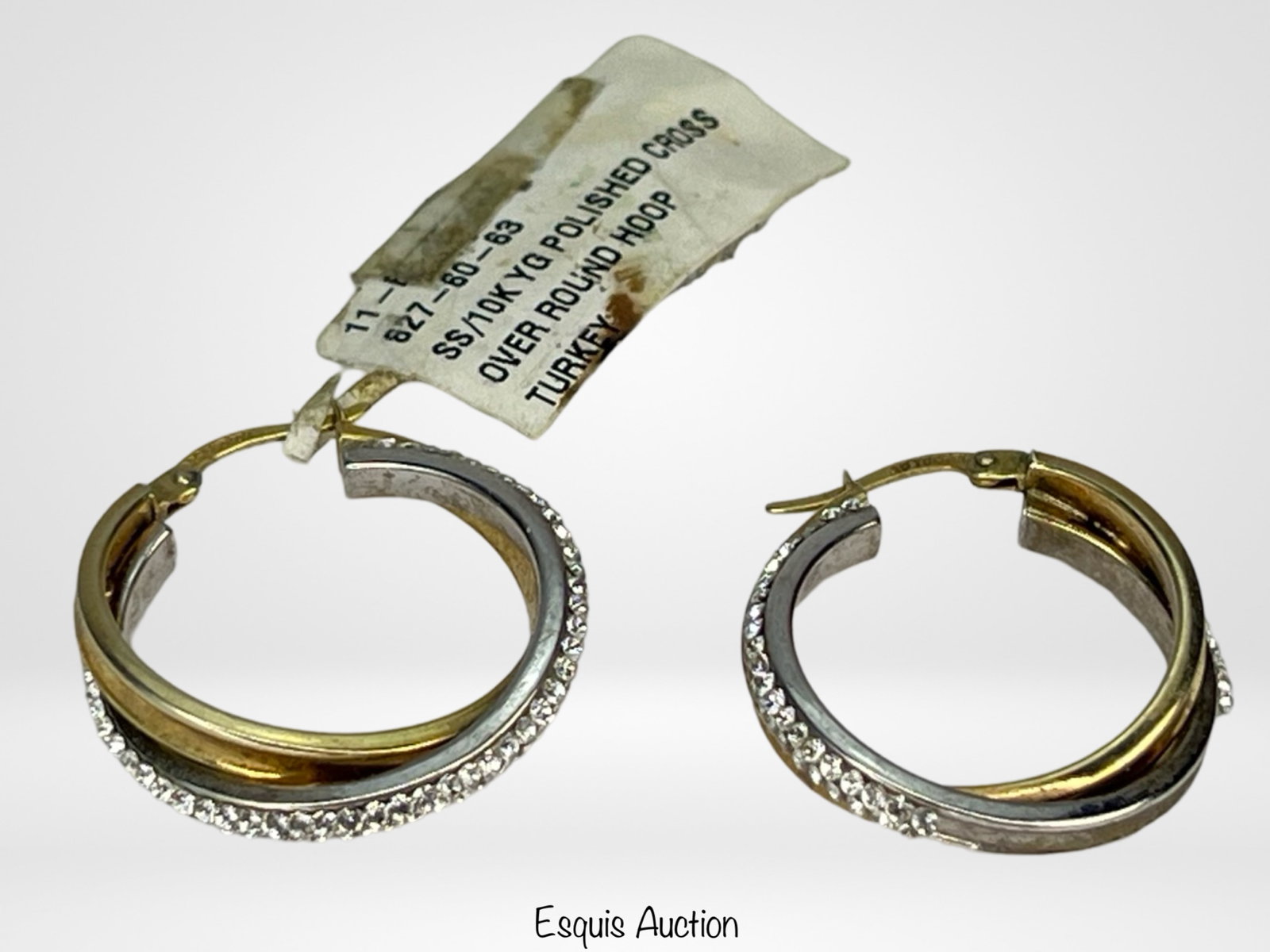 10k Gold & Sterling Silver Hoop Earrings: 10k Gold & Sterling Silver polished cross over round hoop earrings. Approx. 1" in dia. New with tag.