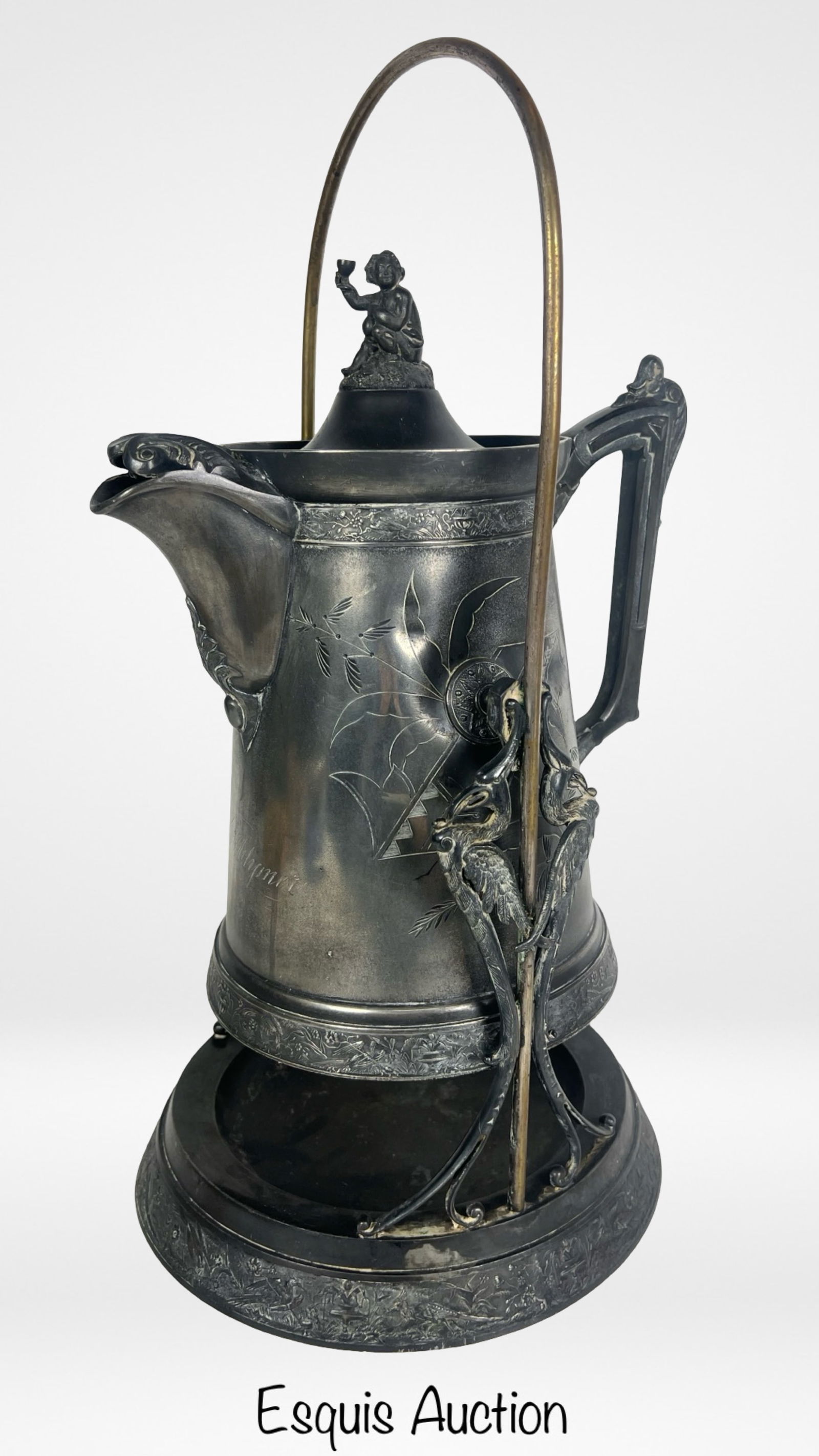 Victorian Antique Silver PlateTilting Pitcher: Victorian Antique Silver PlateTilting Pitcher from 1870s. 19" tall.