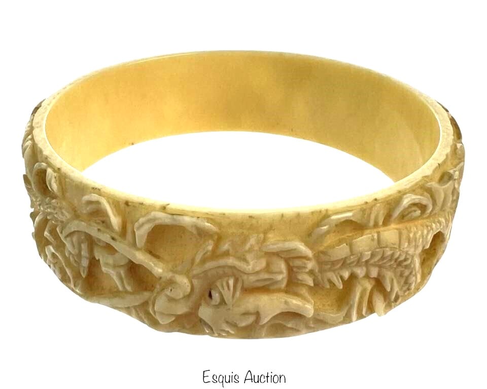 Antique Chinese Carved Bone Bracelet w/ Dragons: Step into the rich history of Chinese craftsmanship with this Antique Carved I**ry Bangle Bracelet adorned with Dragons. This captivating piece is a testament to the artistry of Chinese artisans, feat