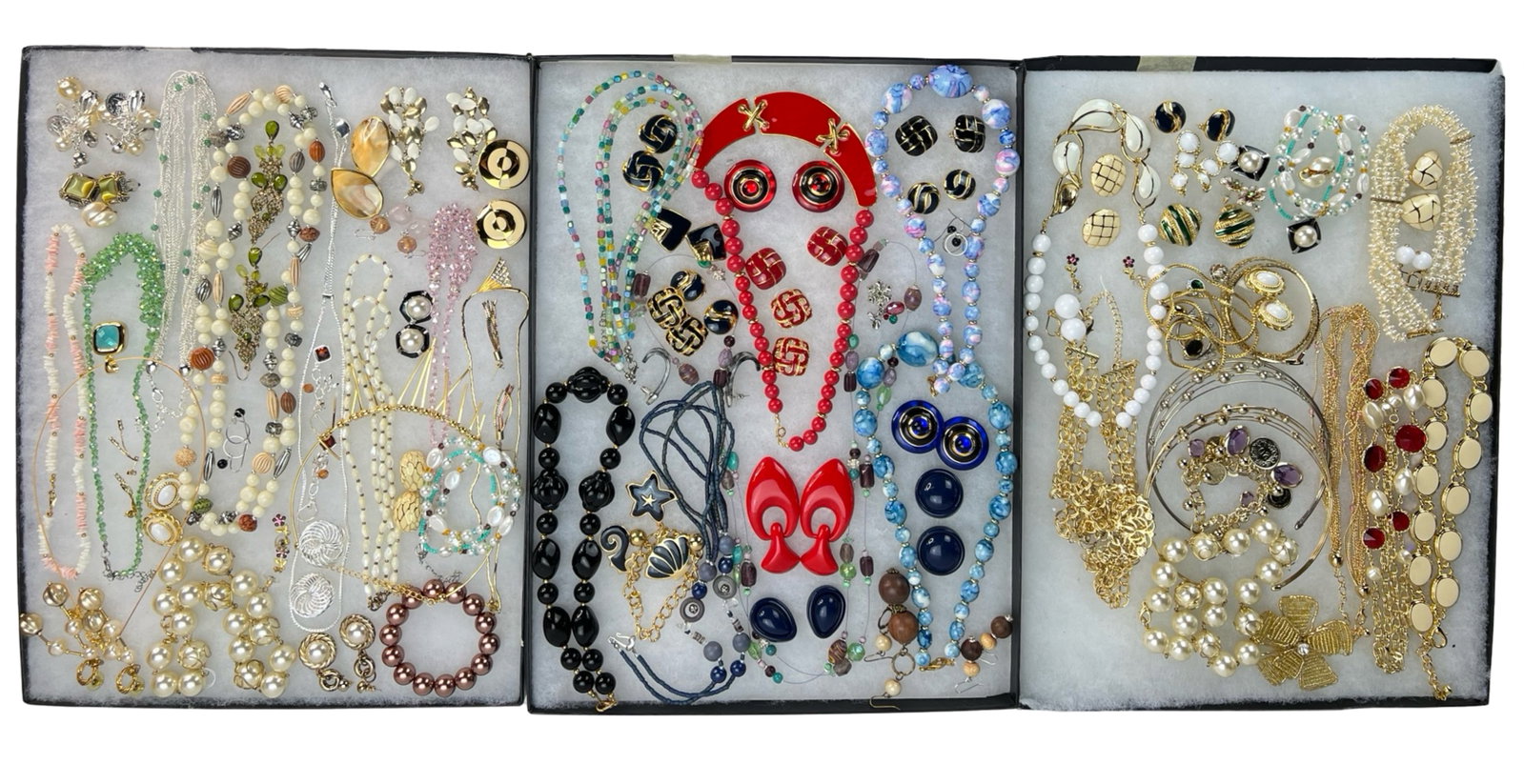 Assortment of Costume Jewelry: Elevate your style with this dazzling Assortment of Costume Jewelry. Bursting with variety, this collection features an array of necklaces, earrings, bracelets, and more, each piece designed to add a 
