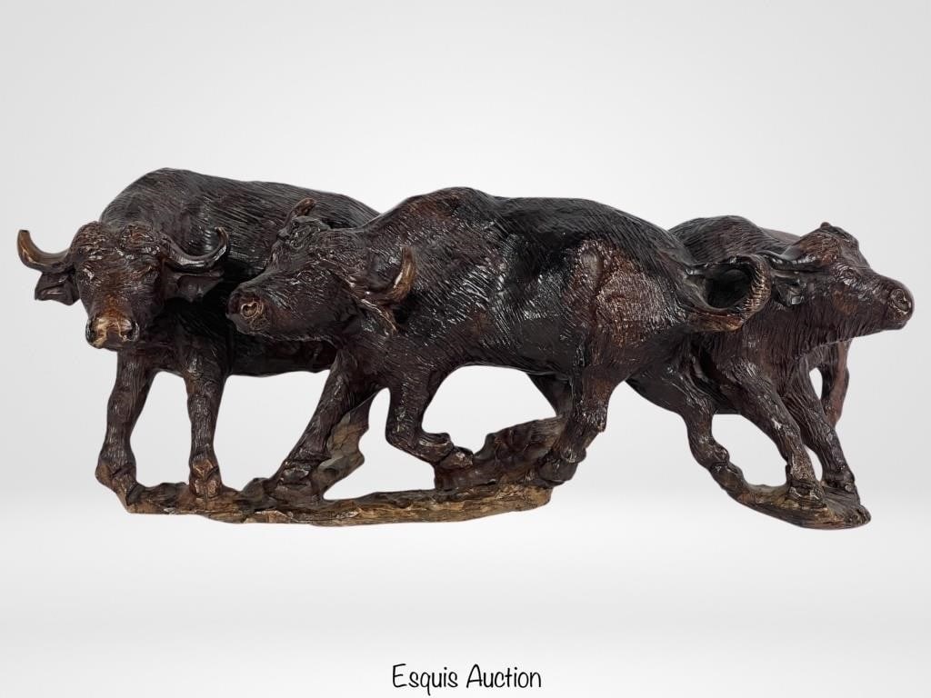 Old Ironwood Buffalo Herd Wood Carved Sculpture: Capture the spirit of the American West with the Old Ironwood Buffalo Herd Wood Carved Sculpture. Standing at 16" tall and 6" wide, this exquisite piece of handcrafted artistry celebrates the majestic