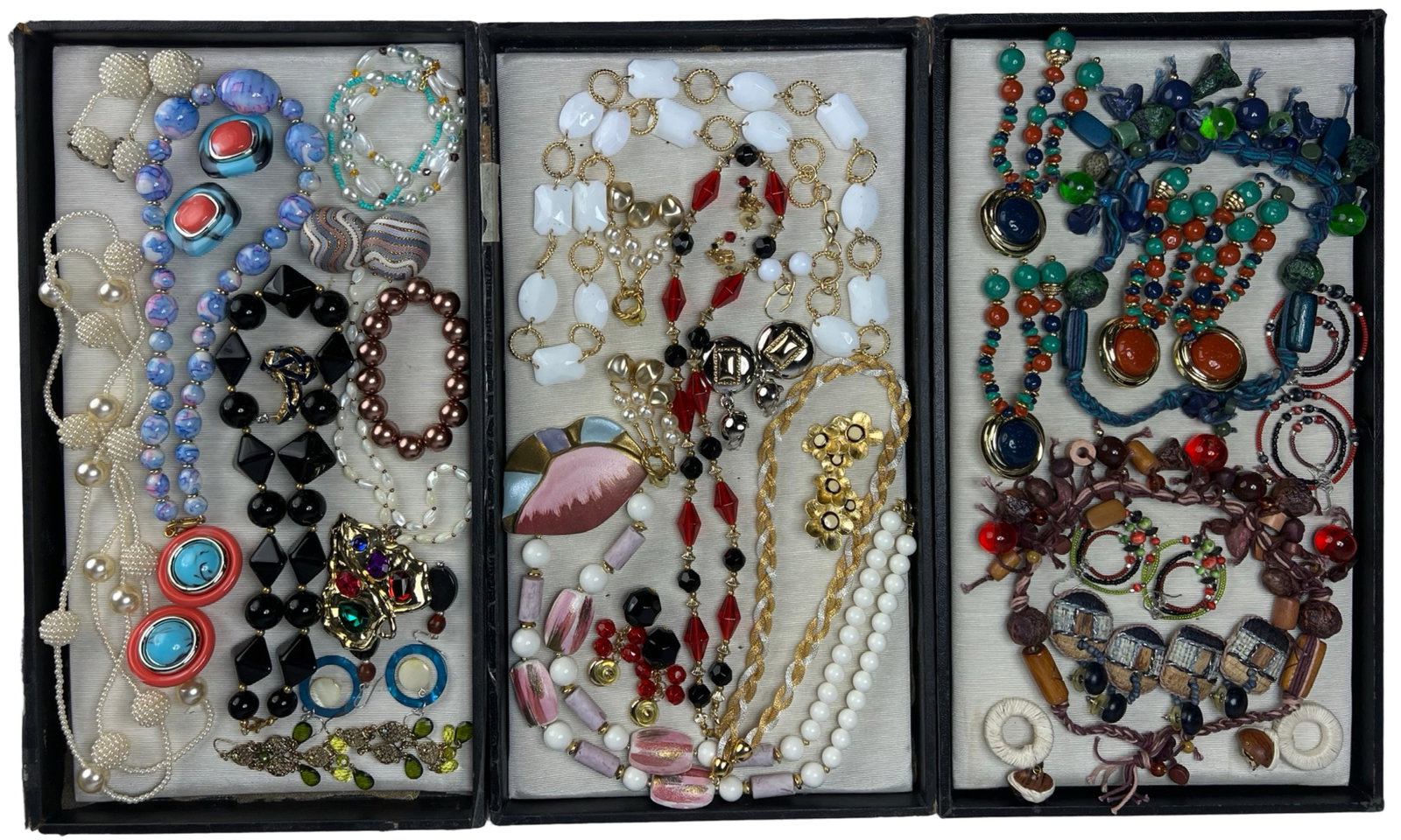 Assortment of Costume Jewelry: Elevate your style with this dazzling Assortment of Costume Jewelry. Bursting with variety, this collection features an array of necklaces, earrings, bracelets, and more, each piece designed to add a 