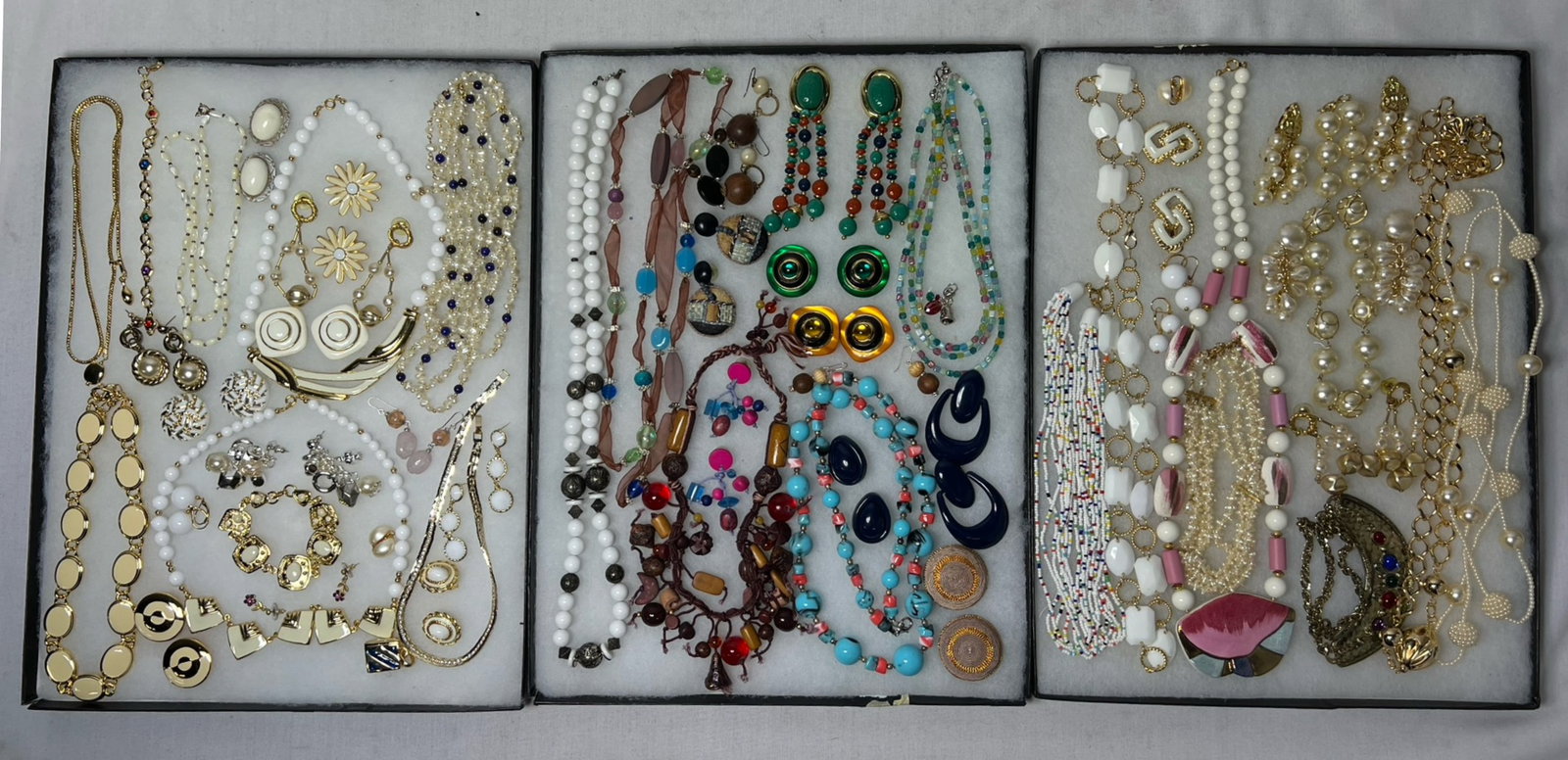 Assortment of Costume Jewelry: Elevate your style with this dazzling Assortment of Costume Jewelry. Bursting with variety, this collection features an array of necklaces, earrings, bracelets, and more, each piece designed to add a 