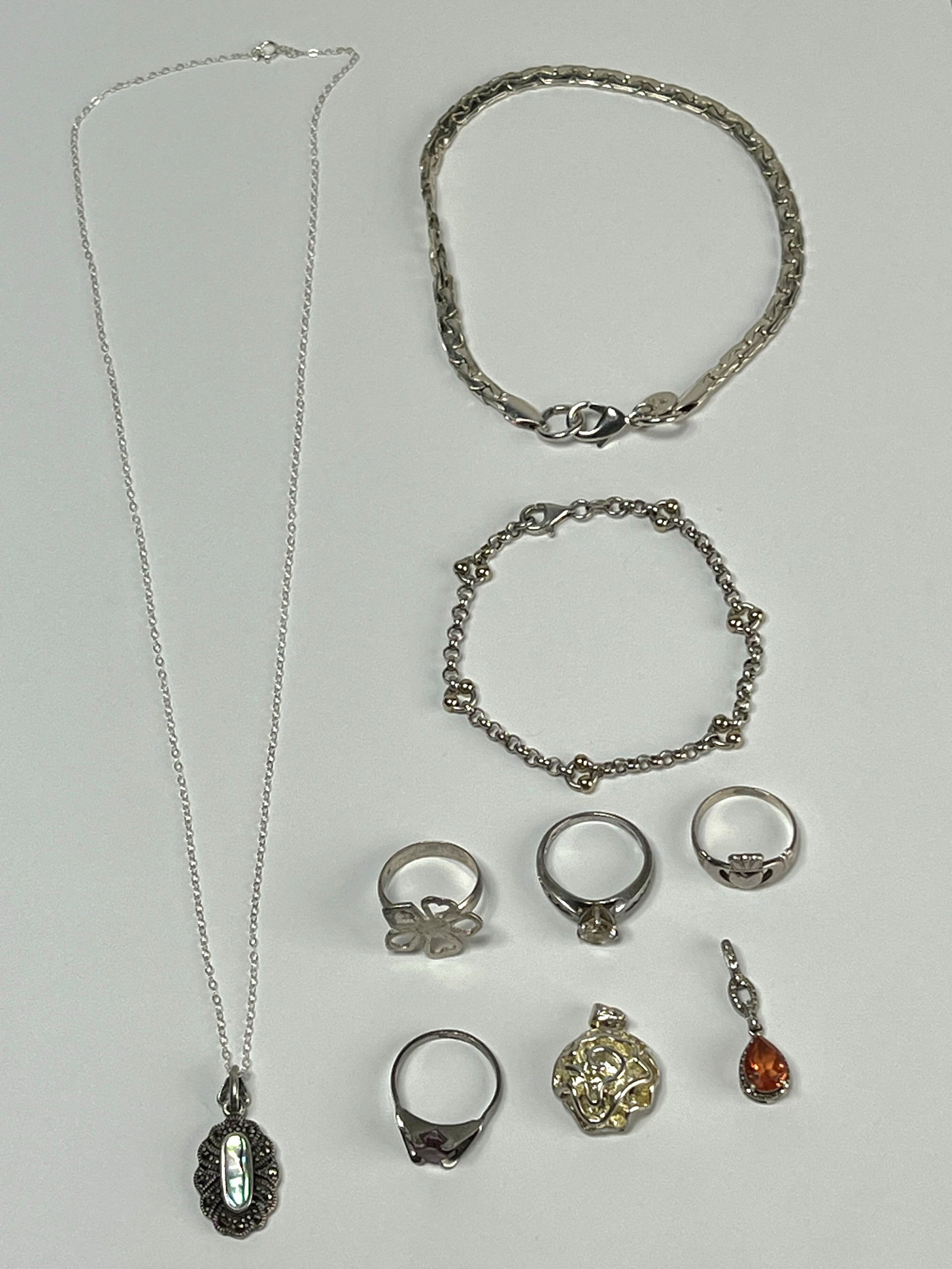 Sterling Silver Jewelry- Rings, Bracelets, Pendant: Group of Sterling Silver Jewelry. Bracelets are 10 1/4" & 7 1/4" long, Ring Sizes 6 1/2- 7". All are in good condition.