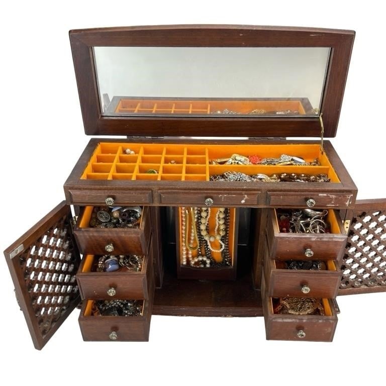 Large Jewelry Box Full of Unsearched Vintage Jewel: Discover a treasure trove within a large jewelry box brimming with unsearched vintage jewelry. Each piece holds the allure of bygone eras, featuring an assortment of necklaces, bracelets, rings, and e