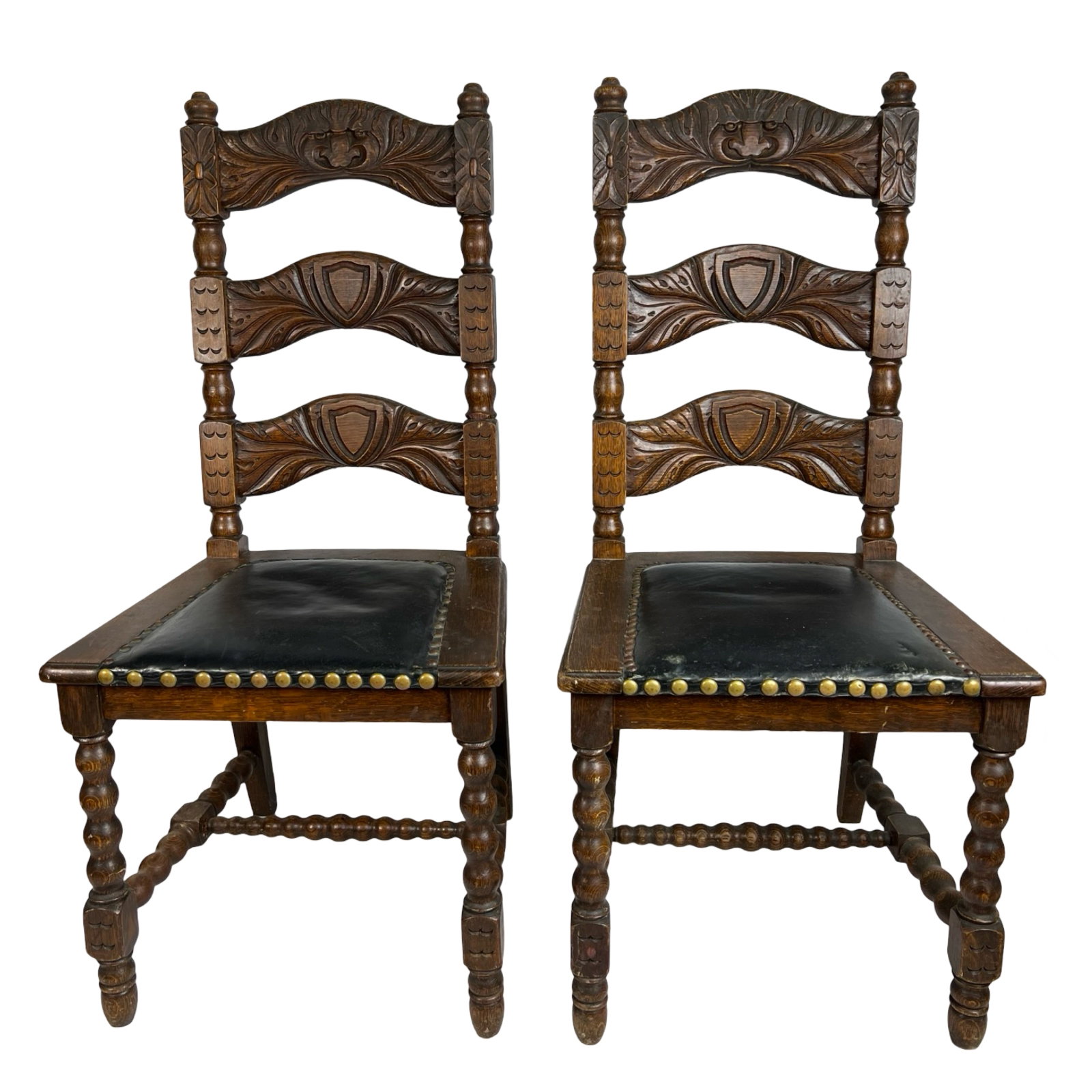 Pair of Ladderback Carved Faces Chairs: Pair of Ladderback Carved Faces Chairs. 41" tall. Good overall condition.