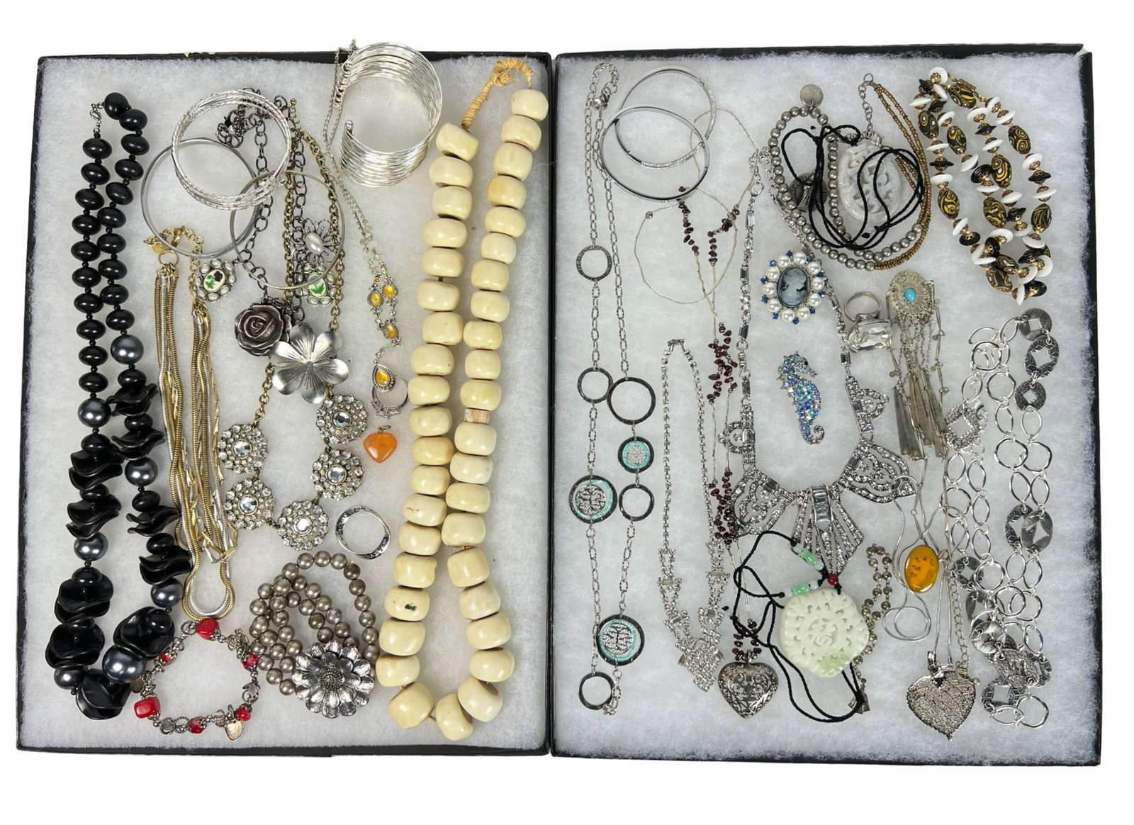 Assortment of Costume Jewelry: Elevate your style with this dazzling Assortment of Costume Jewelry. Bursting with variety, this collection features an array of necklaces, earrings, bracelets, and more, each piece designed to add a 