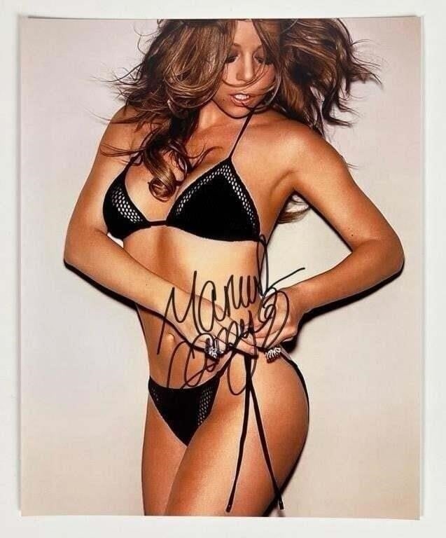 Mariah Carey Signed/ Autographed Photograph: Add a touch of glamour to your collection with this autographed photograph of Mariah Carey. Measuring 8" x 10", this stunning piece captures the iconic singer in all her elegance and charm.Mariah Care
