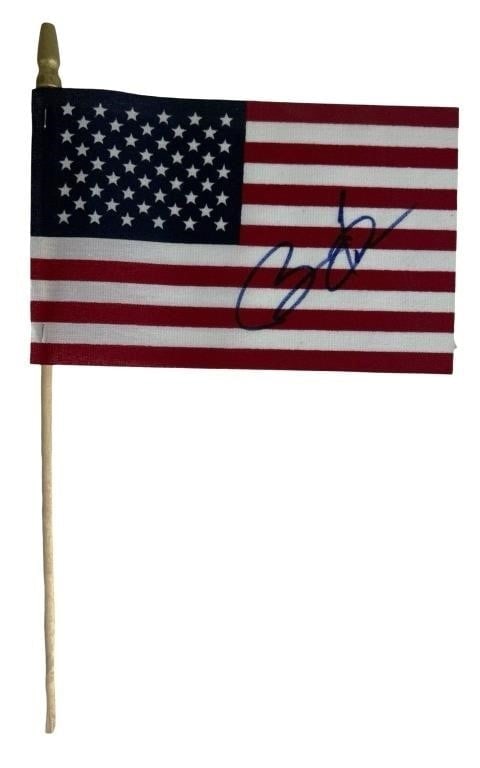 President Barack Obama Signed Mini US Flag: A mini US flag autographed by President Barack Obama, signed during the 2008 Democratic National Convention. This unique piece of political memorabilia commemorates a pivotal moment in American histor