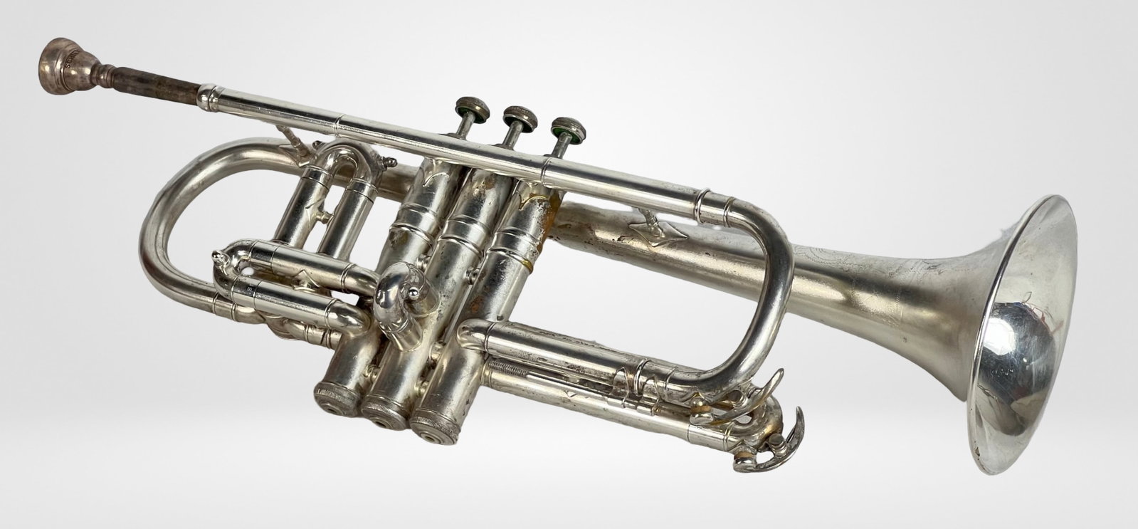 1924 C.G. Conn Trumpet: This trumpet, crafted in 1924 by C.G. Conn, is a fine example of early 20th-century musical instrument craftsmanship. It has been well-preserved and remains in good condition, showcasing the durabilit