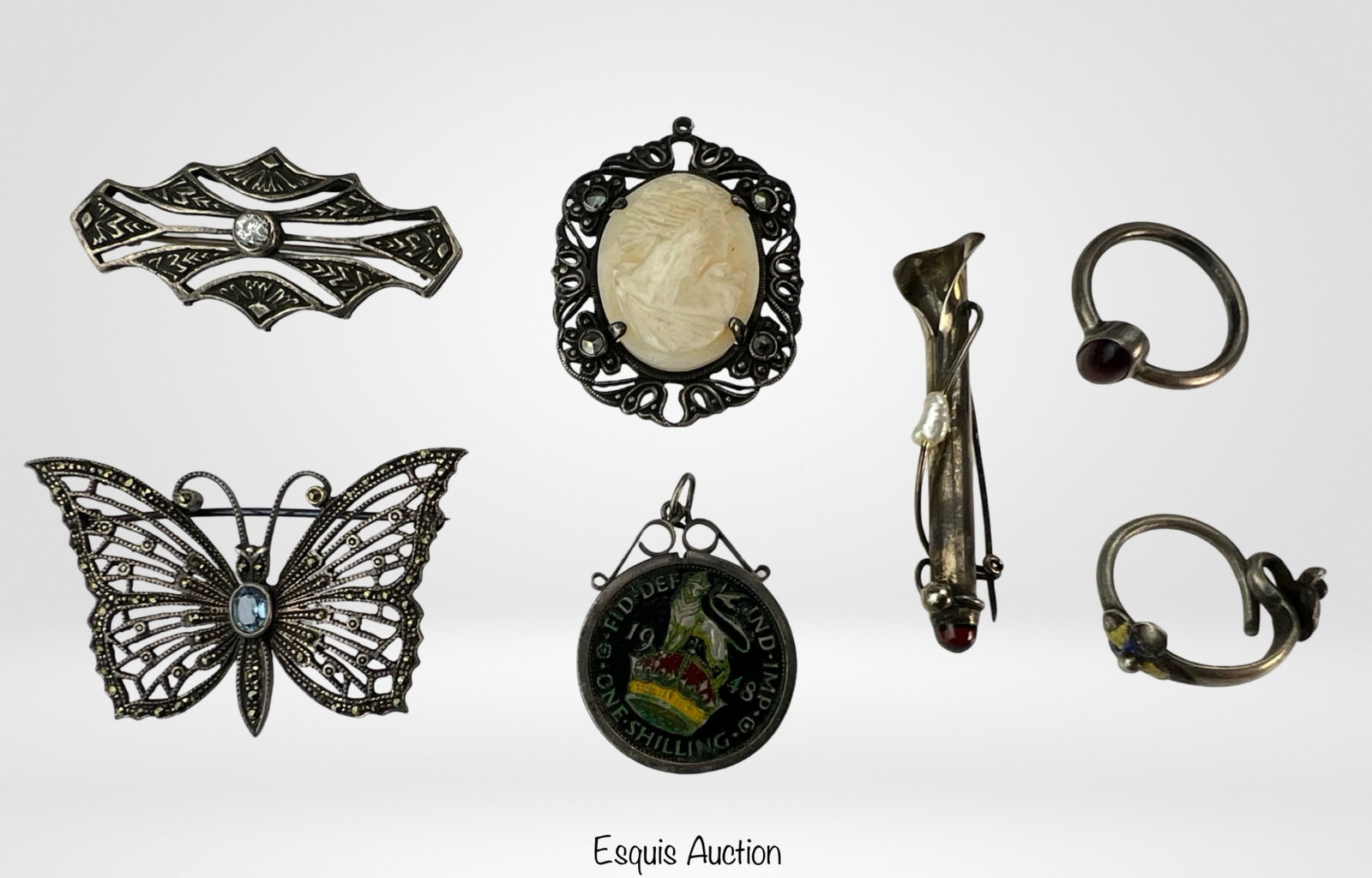 1920's-1940's Edwardian Sterling Silver Jewelry: earlier 20th Century Edwardian Sterling Silver Jewelry including 4 Brooches, 1948 Shilling Pendant and two Rings. Ring sizes- 7 & 5, largest brooch is 1 7/8" long.