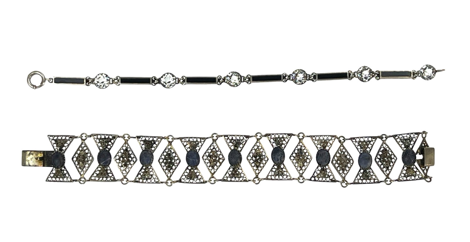 Two Vintage Lady's Sterling Silver Bracelets: Two Vintage Lady's Sterling Silver Bracelets- Filigree Link Bracelet with Lapis Lazuli Stones and Bracelet inlay with Black Onyx & Sparklyng Crystals. 7 3/4" x 7/8" and 7 3/4". Good Condition.