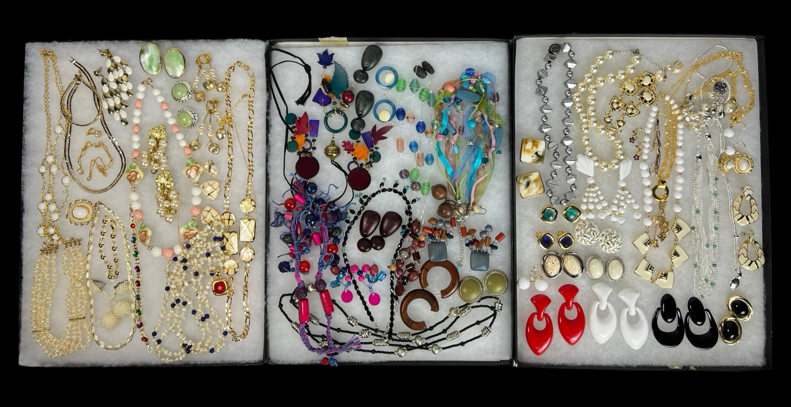 Assortment of Costume Jewelry - Sparkling Variety: Elevate your style with this dazzling Assortment of Costume Jewelry. Bursting with variety, this collection features an array of necklaces, earrings, bracelets, and more, each piece designed to add a 