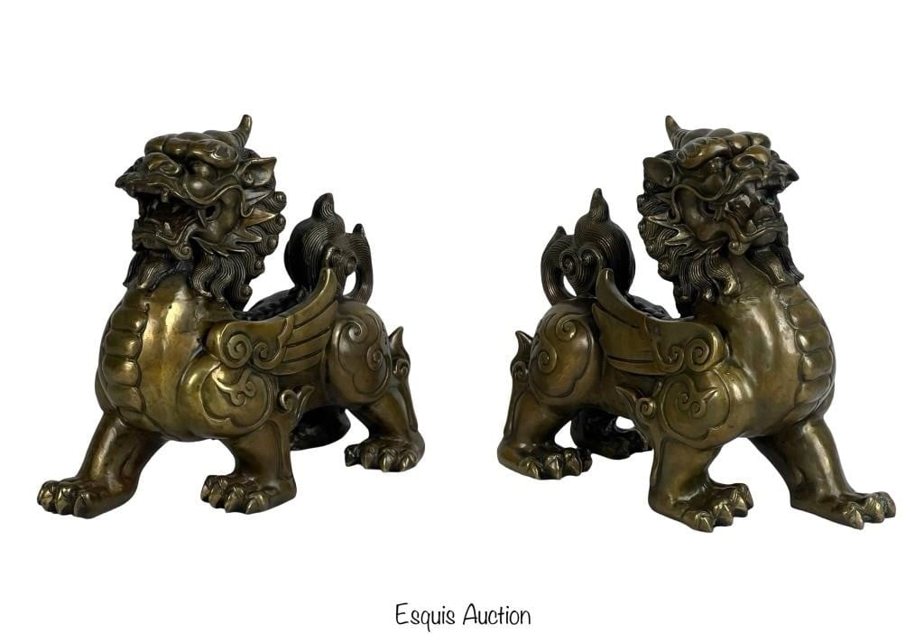 Chinese Bronze Pixiu Winged Beast Lions Sculptures: A stunning pair of Chinese bronze Pixiu winged beast lions sculptures. These impressive pieces are masterfully crafted, showcasing intricate detailing and an imposing presence. Each sculpture features