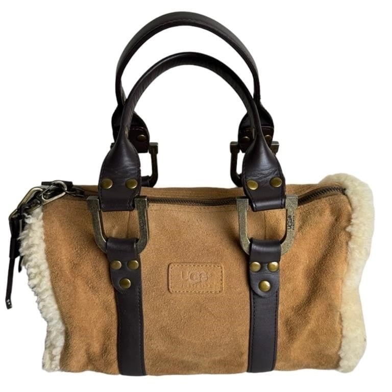 UGG Australia Chestnut Suede Handle Bag: Discover a blend of luxury and practicality with this UGG Australia Chestnut Suede Handle Bag, featuring a stylish shearling sherpa trim. Perfect for adding a touch of sophistication to your everyday 
