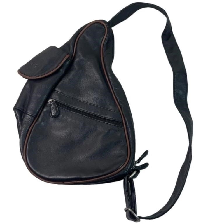 Ameribag Leather Healthy Back Sling Shoulder Bag: Discover the perfect blend of style, comfort, and functionality with this Ameribag Black Leather Healthy Back Sling Shoulder Bag, ideal for travel and daily use.15" x 9". Good slightly pre-loved condi