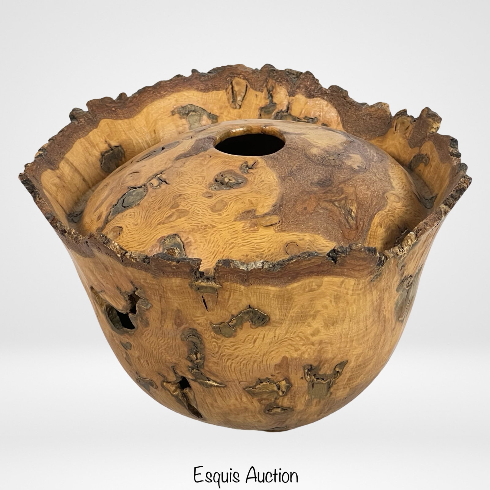 Burl Wood Vessel/ Bowl- Artist Signed: This exquisite burl wood bowl is a stunning piece of craftsmanship, showcasing the natural beauty and unique characteristics of burl wood. The bowl is signed "Tim Franels" at the bottom.6" tall and 9"