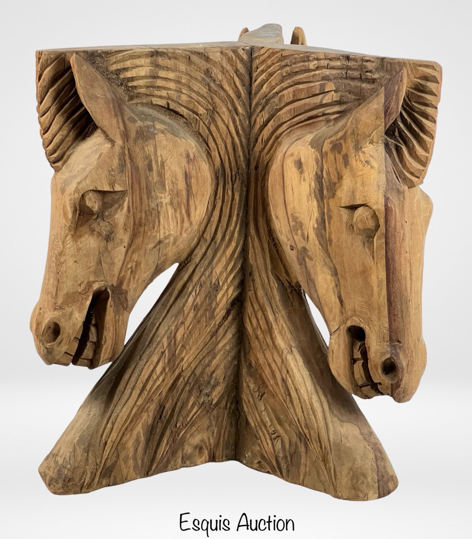Carved Wood Horse Heads Table Base: This intricately carved wooden table base features a striking design of three horse heads, showcasing exceptional craftsmanship and attention to detail. The natural wood finish highlights the texture 
