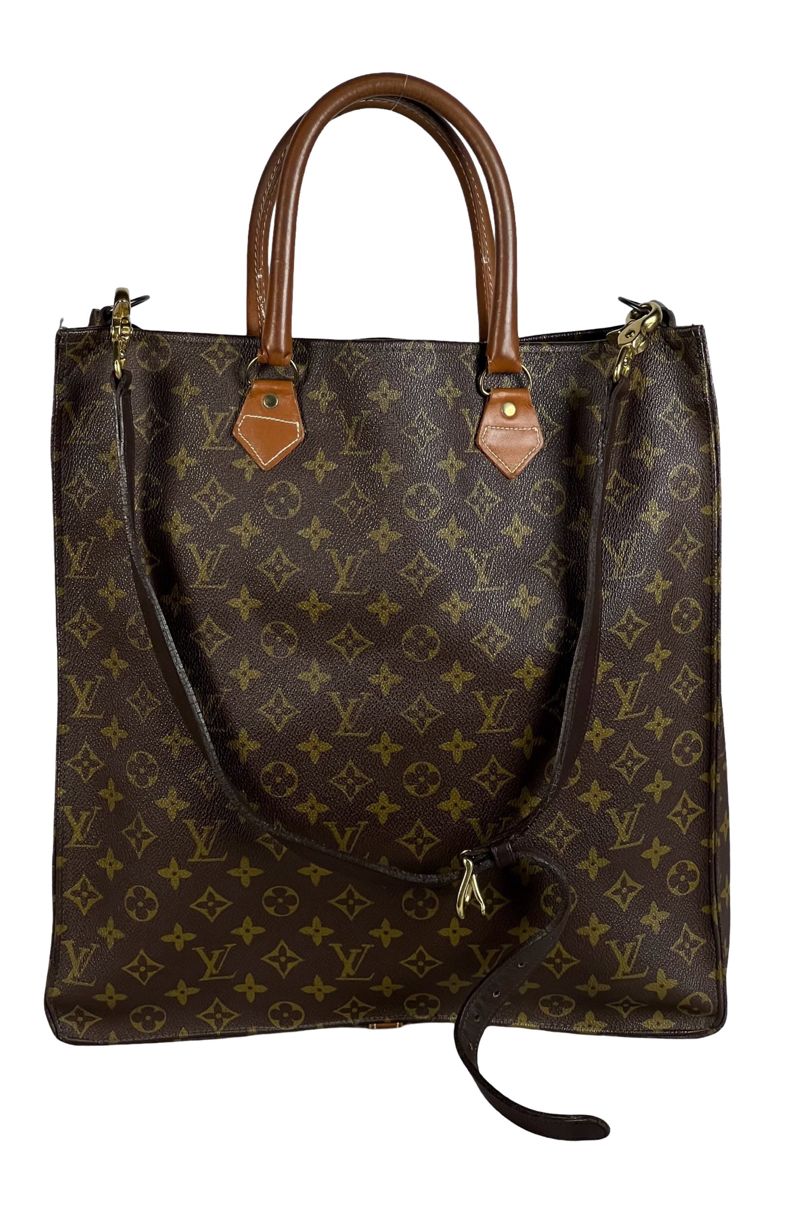 Louis Vuitton Monogram Sac Plat Tote Bag: This Louis Vuitton Monogram Sac Plat Bag is a sophisticated and spacious accessory, perfect for carrying your essentials with style. Measuring 15" x 14", this bag features the iconic LV monogram canva