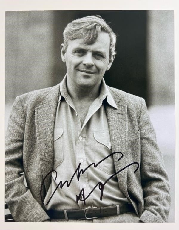 Anthony Hopkins Autographed/ Signed Photograph: This elegant collector's item features Autographed classic black-and-white photograph of the legendary actor Anthony Hopkins. The image captures Hopkins in a relaxed and confident pose, exuding his ch