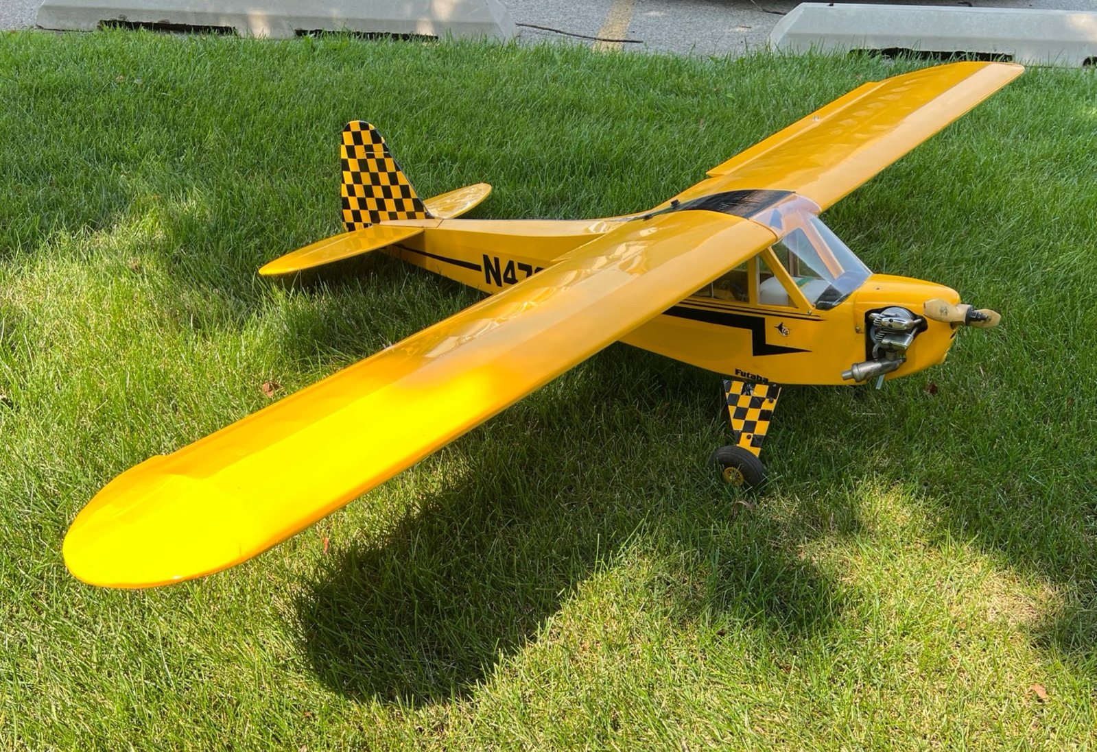 1/4 Scale RV-4 RC Airplane w/ Saito FA 100 Engine: 1/4 scale yellow black and white RV-4 from the Great Planes Model company. The tail dragger has a custom Ultracote covering and paint job. Features a Saito FA 100 four stroke nitro engine with a custo