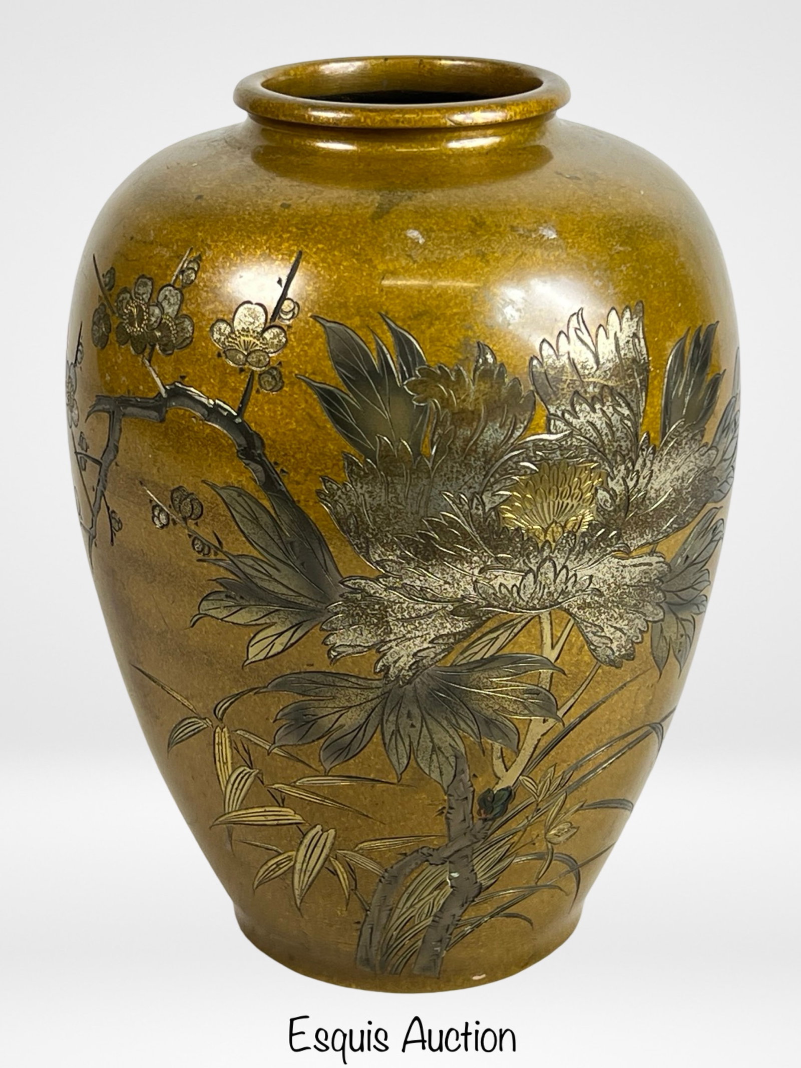 Japanese Meiji Period Bronze Chrysanthemums Vase: This late Meiji Period Japanese bronze vase stands 9 1/2 inches tall and features an exquisite design of chrysanthemums in full bloom. The vase's surface is adorned with finely detailed flowers and le