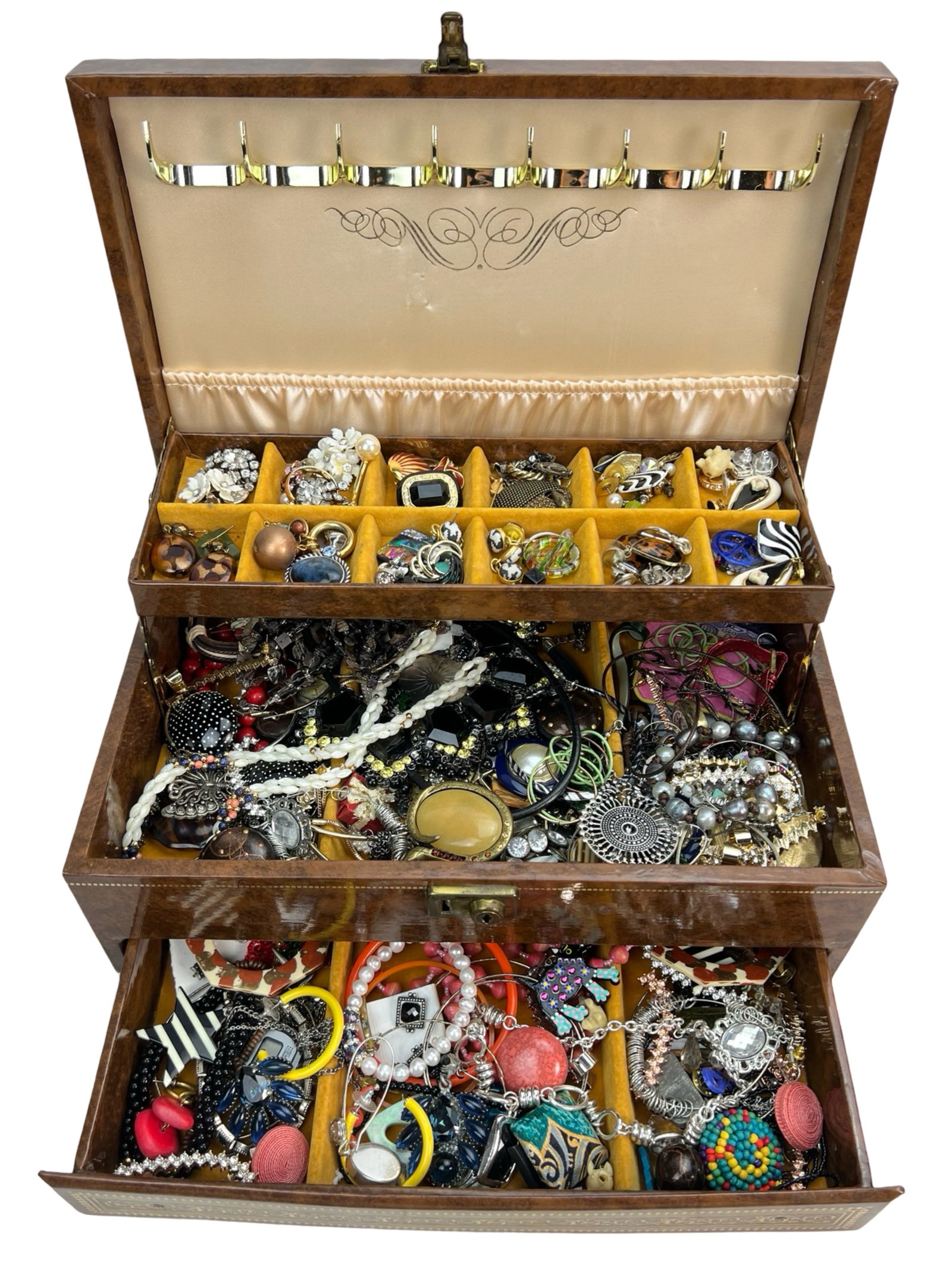 Large Jewelry Box Full of Unsearched Vintage Jewel: Discover a treasure trove within a large jewelry box brimming with unsearched vintage jewelry. Each piece holds the allure of bygone eras, featuring an assortment of necklaces, bracelets, rings, and e