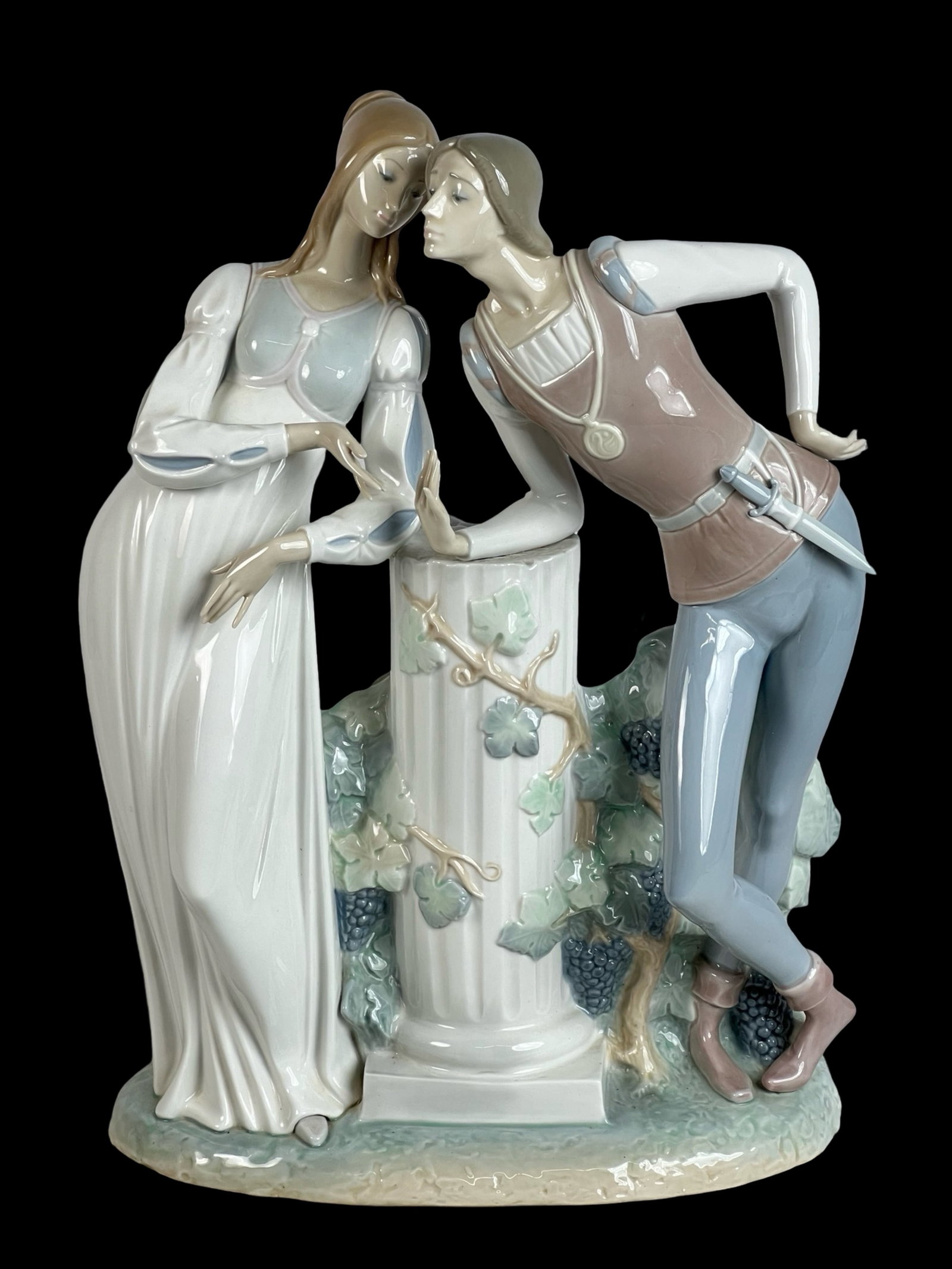 Lladro "Romeo and Juliette" Porcelain Figurine: This exquisite Lladro porcelain figurine, titled "Romeo and Juliette," features a delicate and romantic depiction of the iconic Shakespearean lovers. Standing at 18 inches tall, this piece, numbered 4