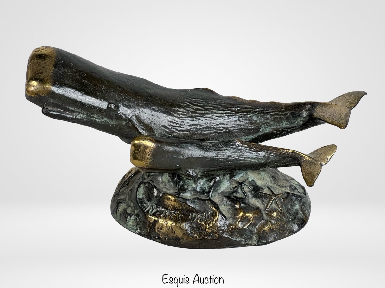 Scott Nelles Cast Bronze Whale & Calf Sculpture: An evocative cast bronze sculpture by renowned artist Scott Nelles, depicting a mother whale and her calf gracefully swimming together. The sculpture, dated 1980 and signed by the artist at the base, 