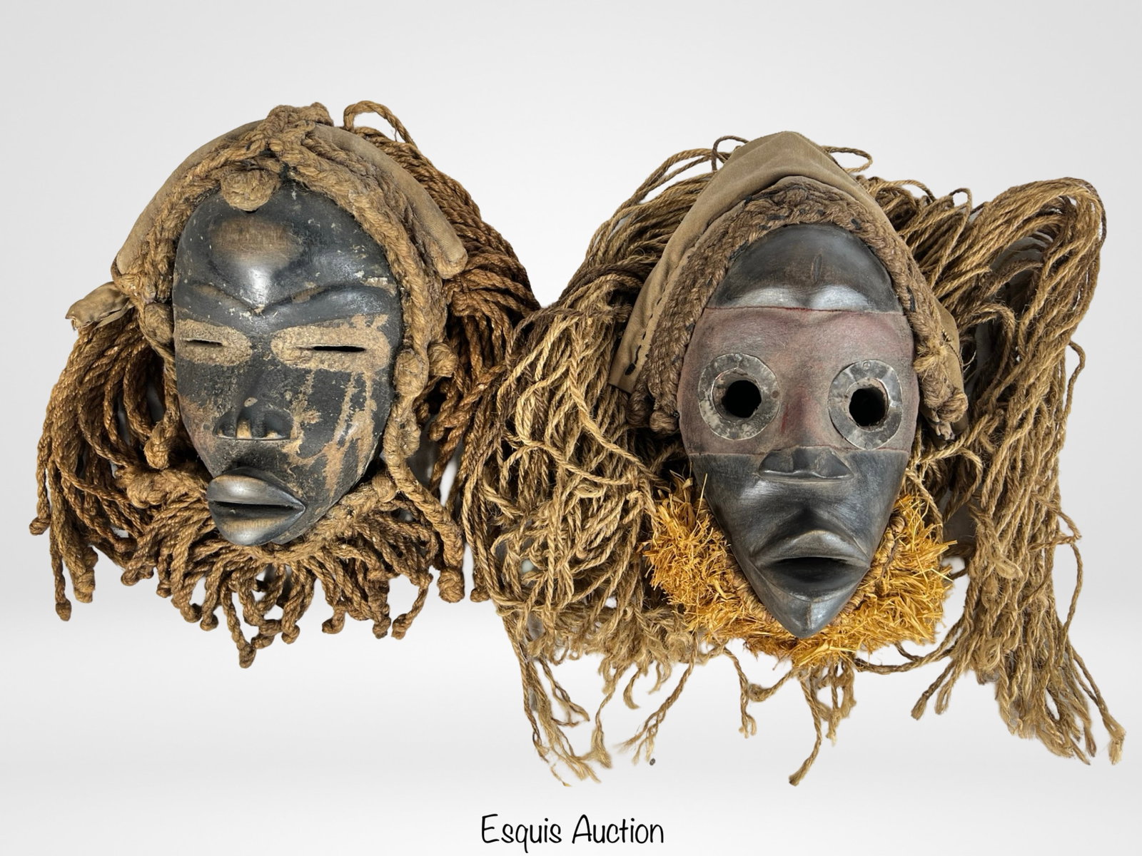 African Pende Tribe Wood Carved Ceremonial Masks: This pair of intricately carved wooden masks hails from the Pende or Chokwe tribes, located in the Congo region. Likely crafted in the early 20th century, these masks feature traditional designs with 