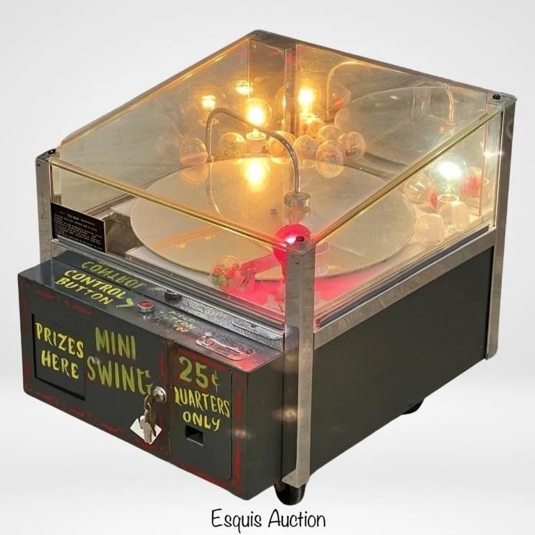 M.S.I. Mini Swing Merchandiser Arcade Vendor Machi: M.S.I. Mini Swing Merchandiser Arcade Vendor Machine. No information found on this machine. Operates on 25c . Most likely custom made. Condition: Apepars to be in working condition, accepts coins. Com