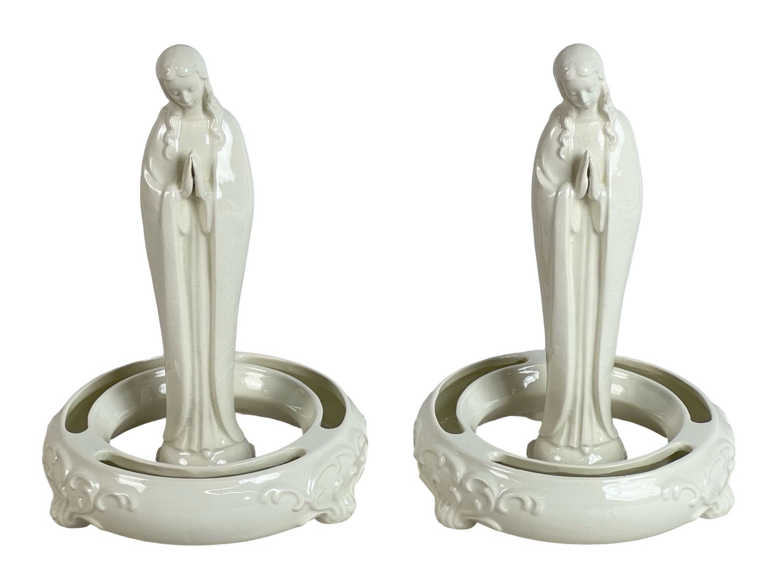 Goebel Praying Madonna Figurines & Flower Rings: This pair of vintage Goebel porcelain figurines features the serene and graceful figure of the Praying Madonna (model HM 58 2/0). Each Madonna stands 8 1/2 inches tall and is adorned with a soft white