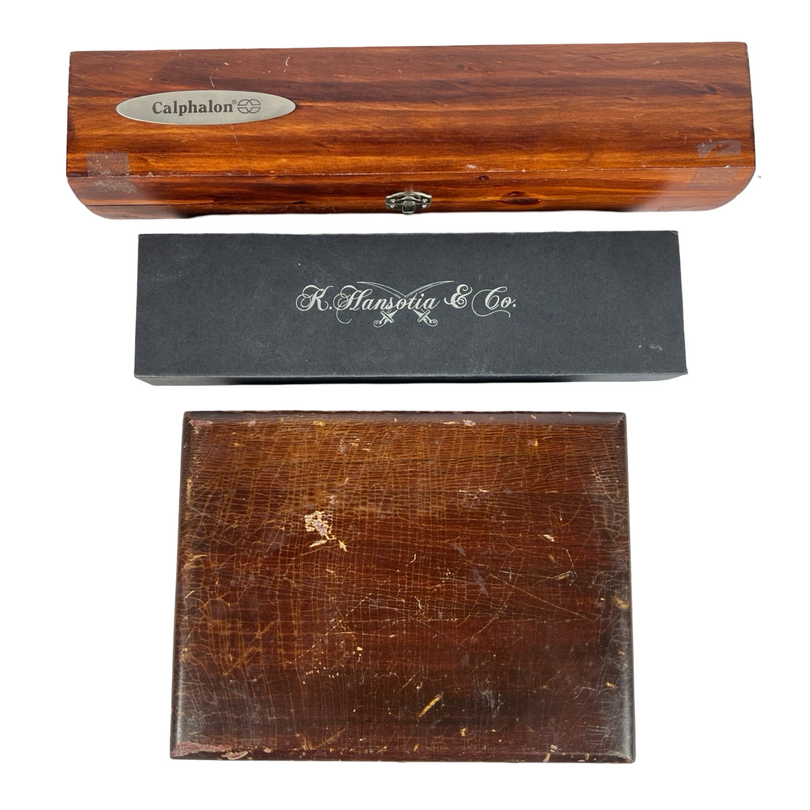 Lot of Cutlery and Knife Sets: This diverse lot includes three unique cutlery sets, each housed in its original storage box: Calphalon Knife Set: This set features a high-quality carving knife and fork, presented in a wood grain bo