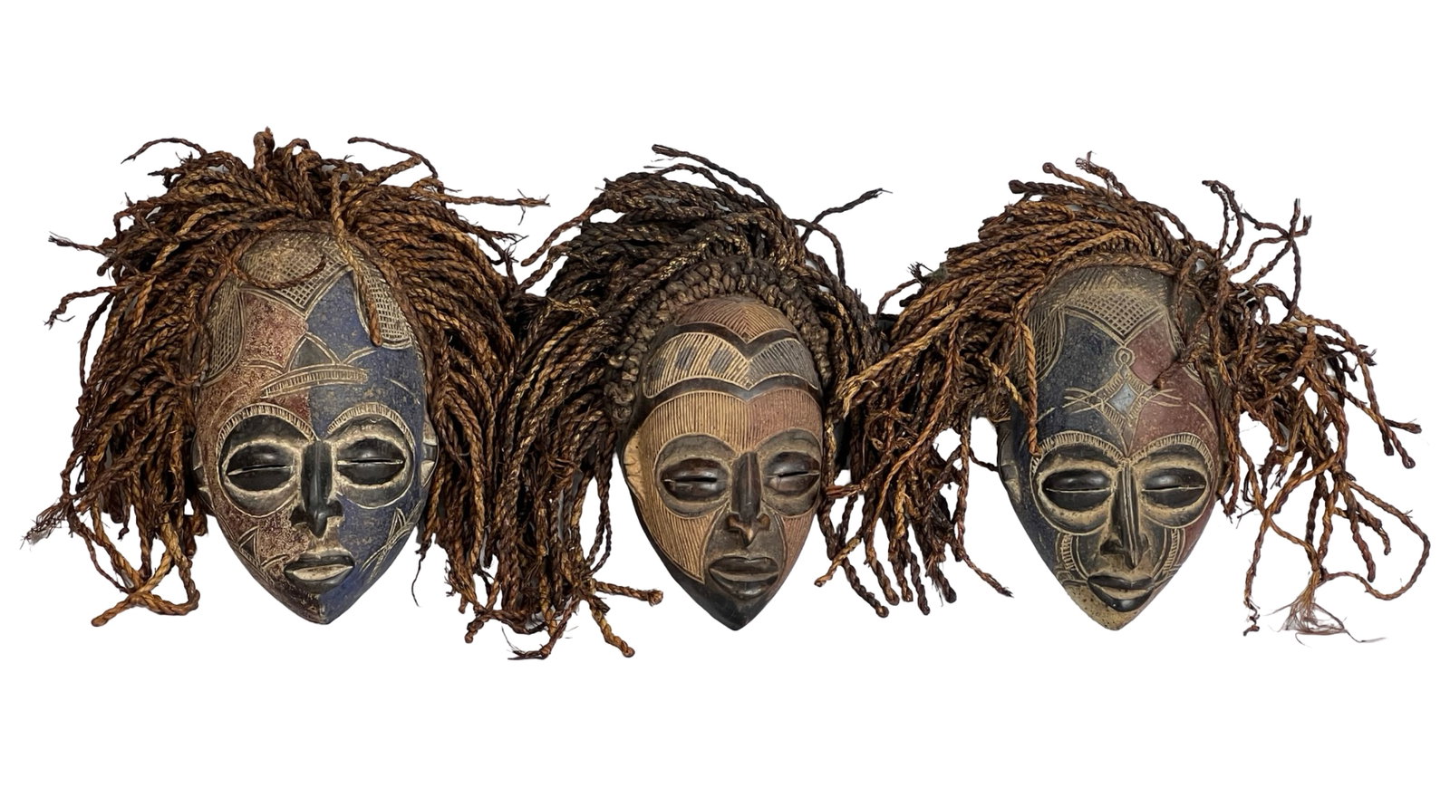African Pende Tribe Wood Carved Ceremonial Masks: This trio of intricately carved wooden masks hails from the Pende or Chokwe tribes, located in the Congo region. Likely crafted in the early 20th century, these masks feature traditional designs with 