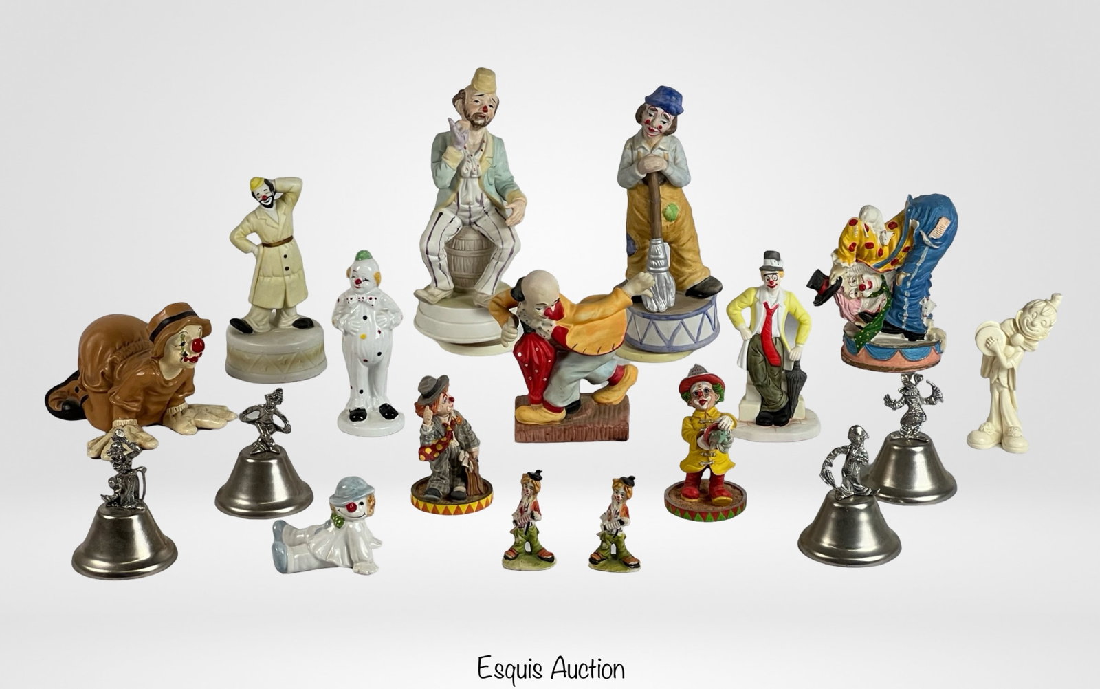 Collection of Clown Figurines: This whimsical collection features a variety of clown figurines made from different materials such as ceramic, porcelain, and metal. The clowns are depicted in various poses and styles, capturing the 