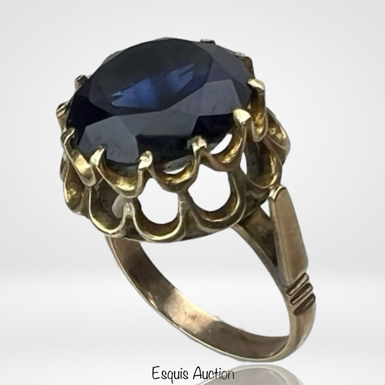 10k Gold Lady's Sapphire Ring: 10k Gold Lady's Ring with Large Lab created Sapphire. Size- 7 1/2. Good Condition.