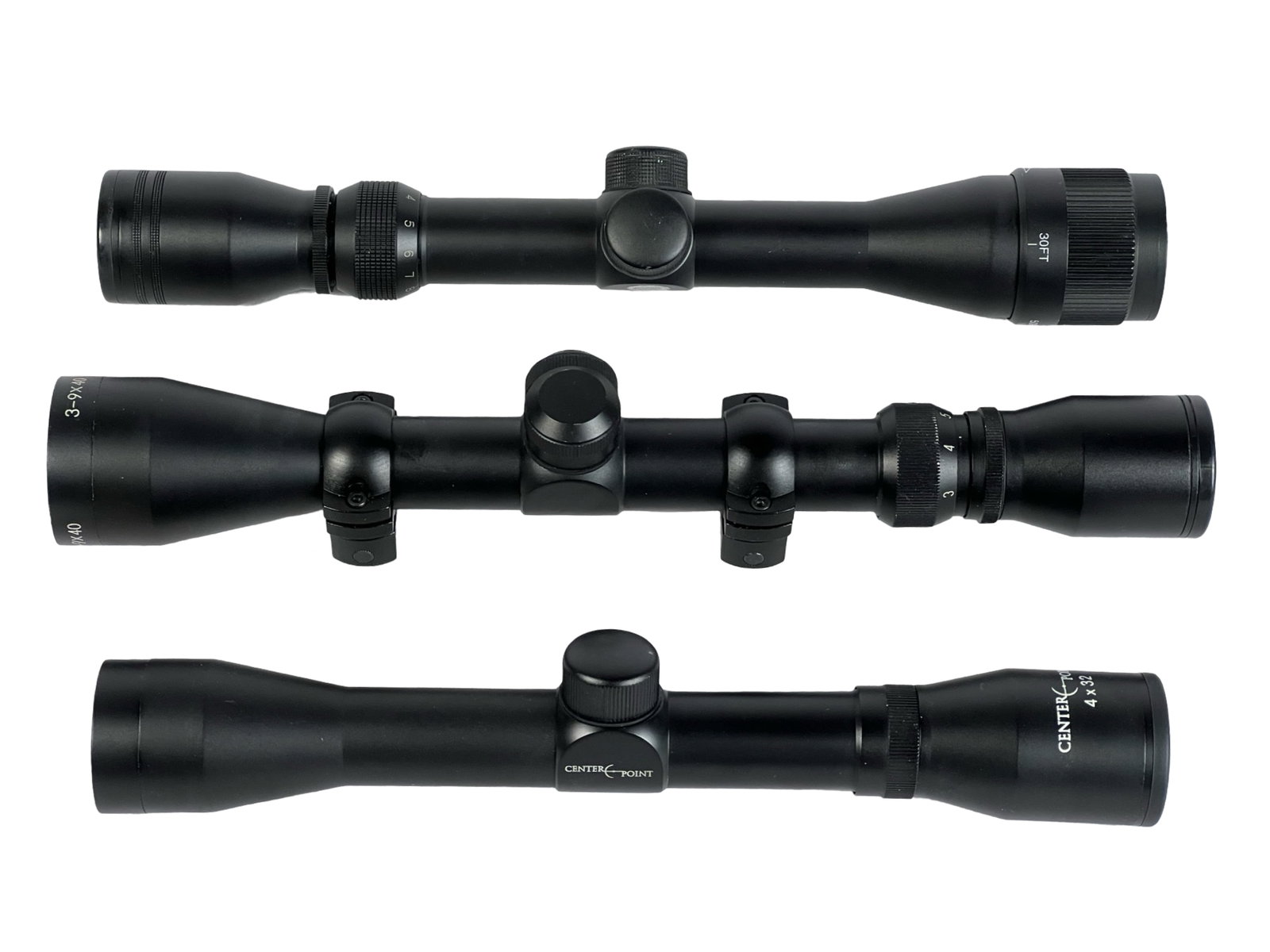 Lot of 3 Rifle Scopes - CenterPoint: This lot features three black rifle scopes from notable brands, including CenterPoint 4x32 and a 3-9x40 scope. Each scope offers various magnification levels and precision for shooting accuracy. The C