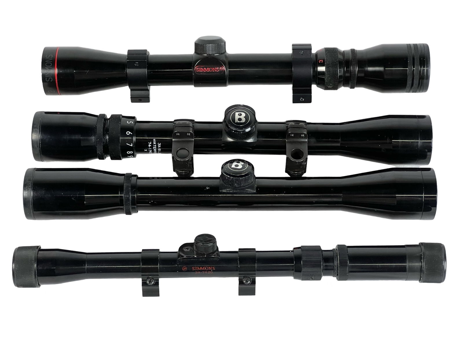 Lot of Four Rifle Scopes - Simmons and Bushnell: This lot features four high-quality riflescopes from Simmons and Bushnell, known for their reliability and precision. Each scope offers different magnification options, making them versatile tools for