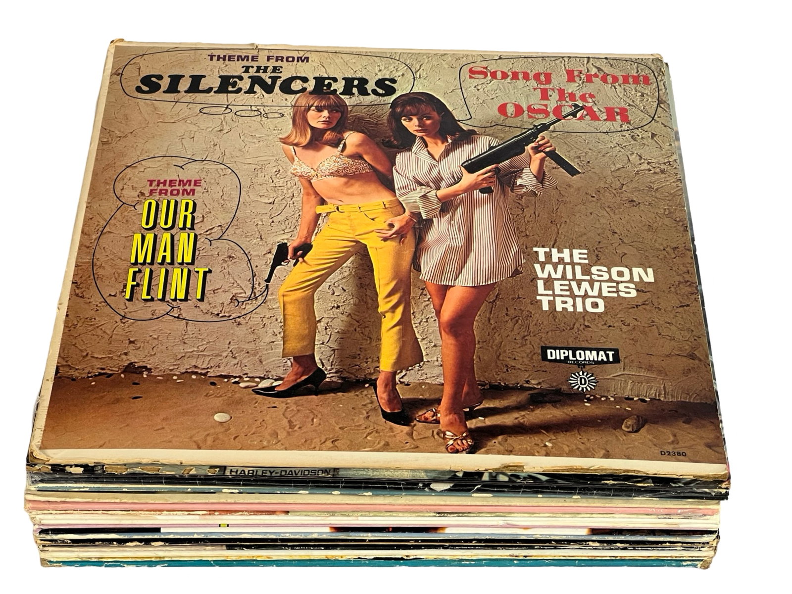 Diverse Vintage Vinyl Records Collection: Explore this eclectic mix of vintage vinyl records, showcasing legendary music from various genres. The collection includes notable artists such as: The Silencers and The Wilson Lewes Trio with their 
