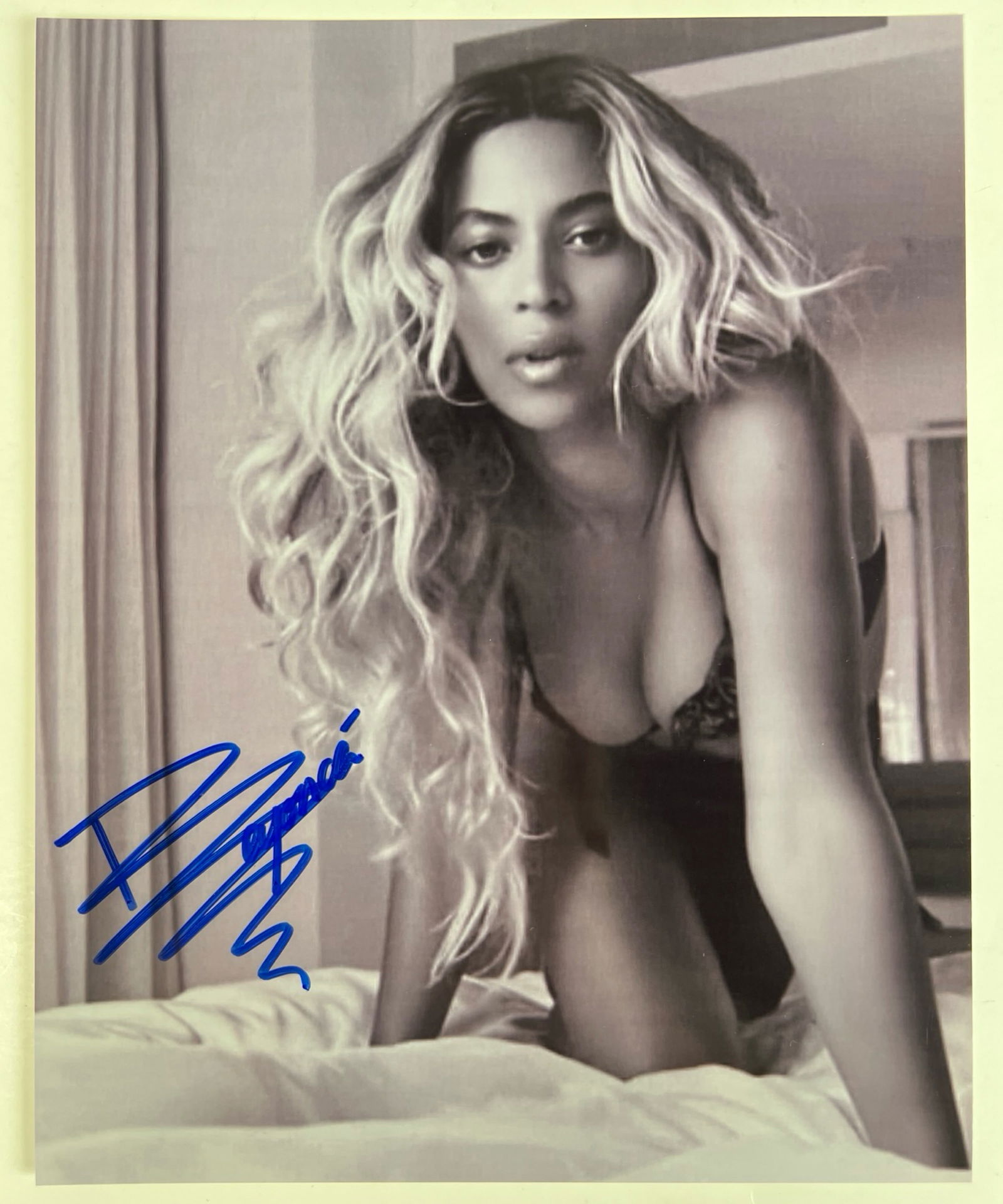 Beyonce Autographed/ Signed Photograph: Own a piece of music royalty with this exclusive Beyonce Autographed 8" x 10" Photograph. This rare and highly coveted item features signature from the global icon and Grammy-winning artist, Beyonce K