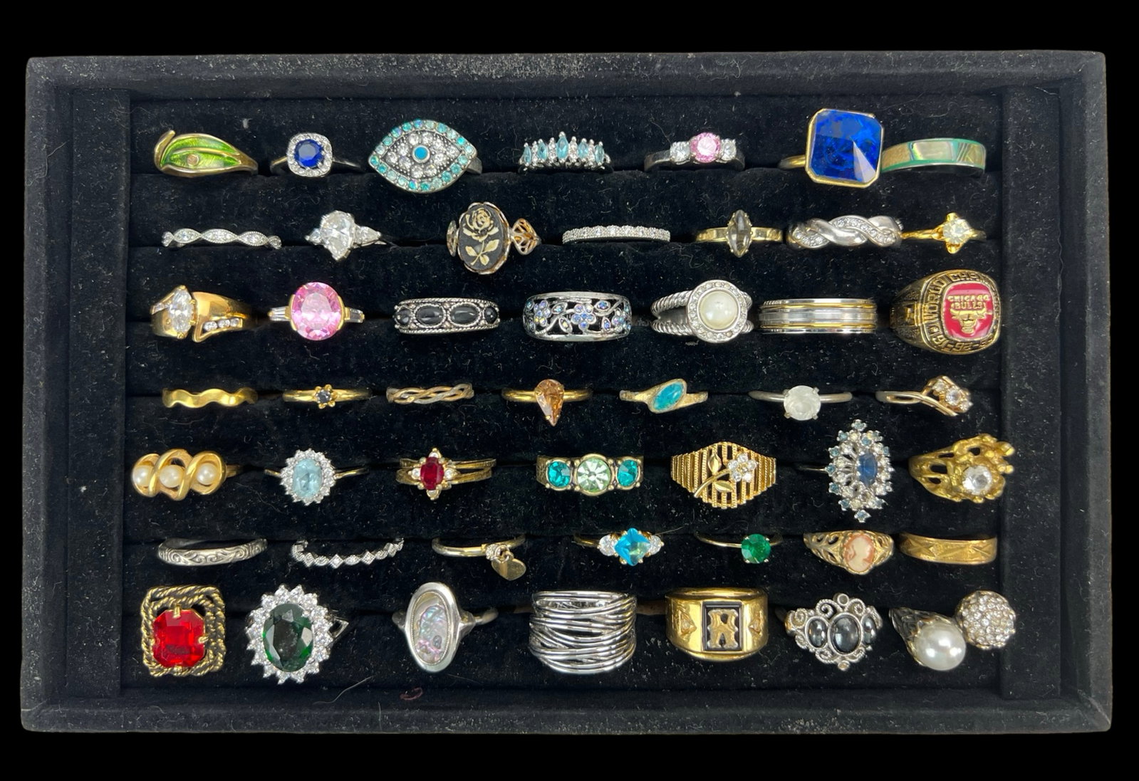 Collection of 49 Assorted Ring: A beautiful collection of 49 mostly lady's rings, showcasing a wide variety of styles and designs.All appear to be in good condition. Tray is not included.